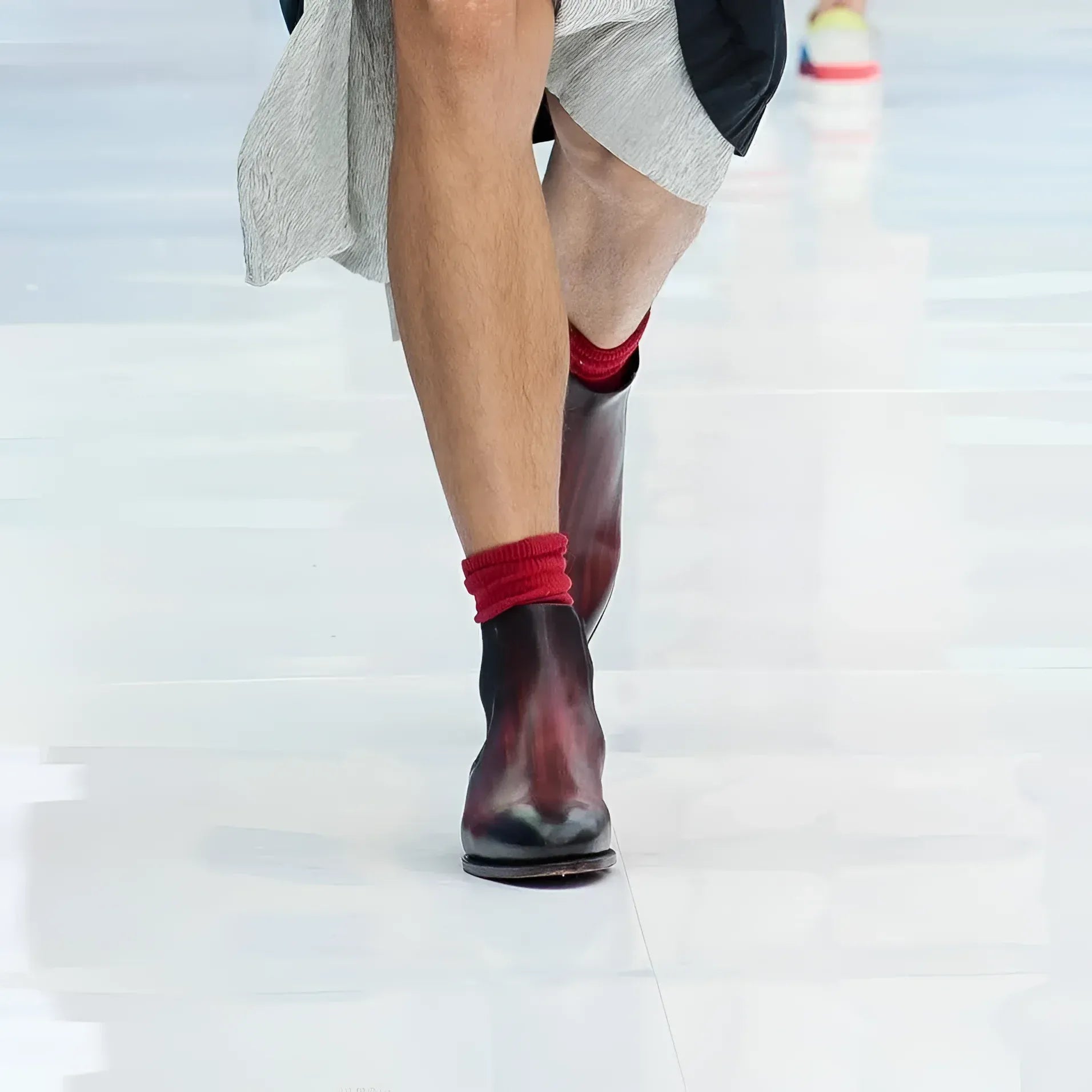 Burgundy Patina Chelsea Boots paired with vibrant red socks for stylish footwear