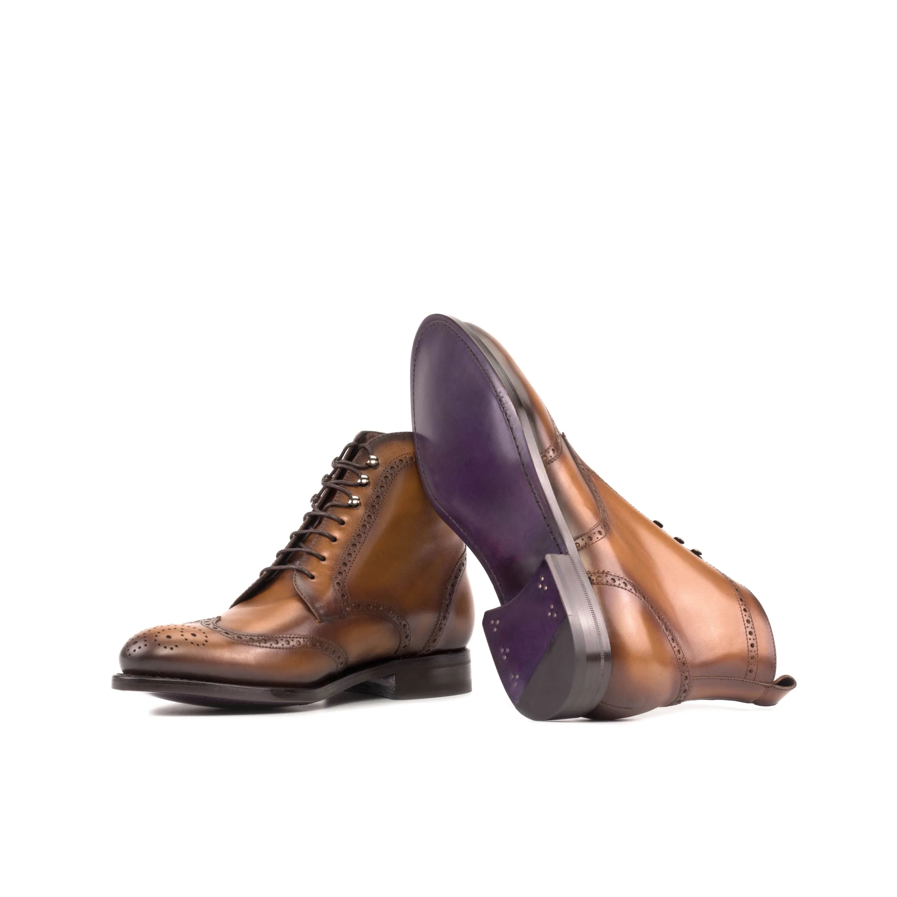 Brown calf leather military brogue boots featuring a wingtip design