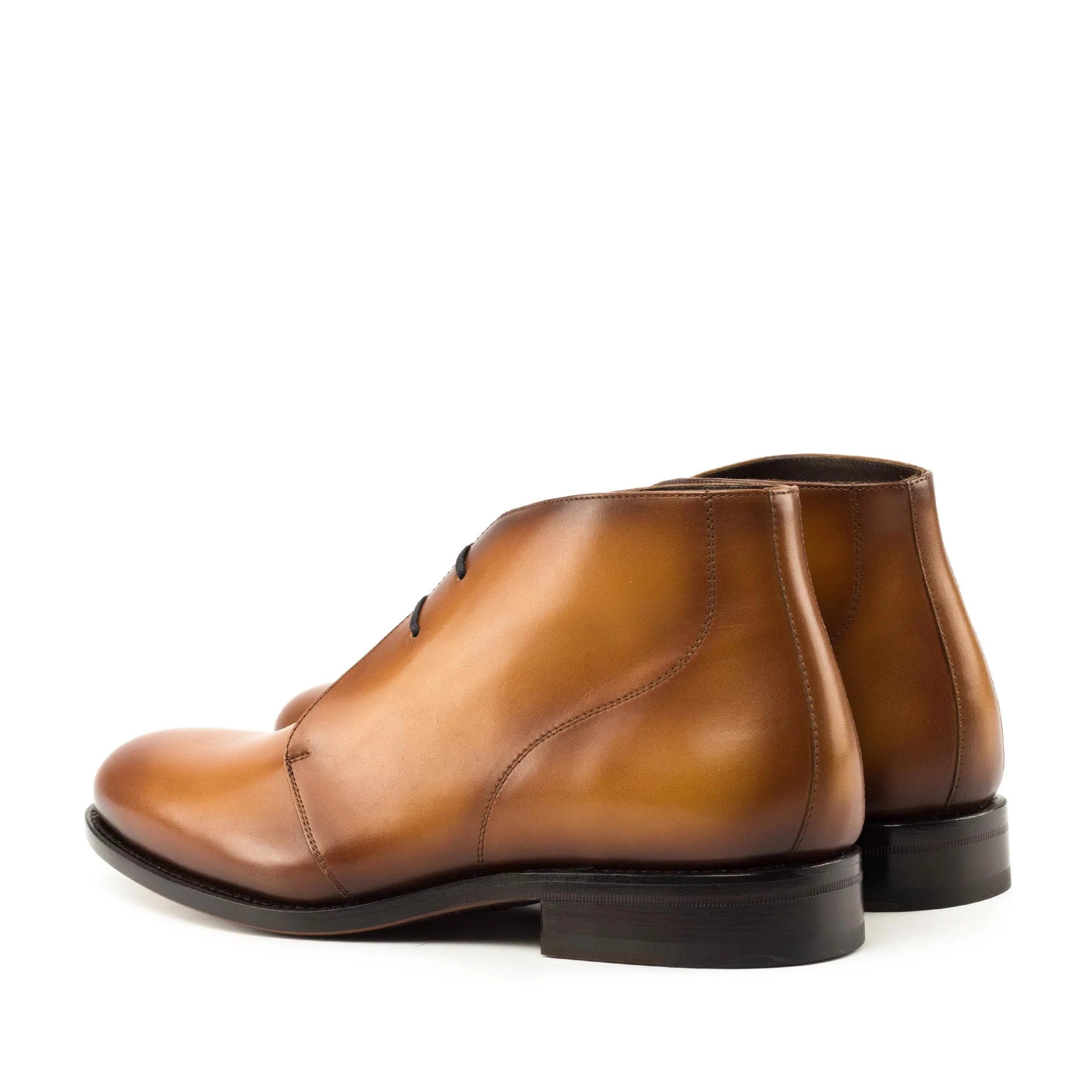 Brown leather chukka boots from 6011, a staple in luxury bespoke shoes for men