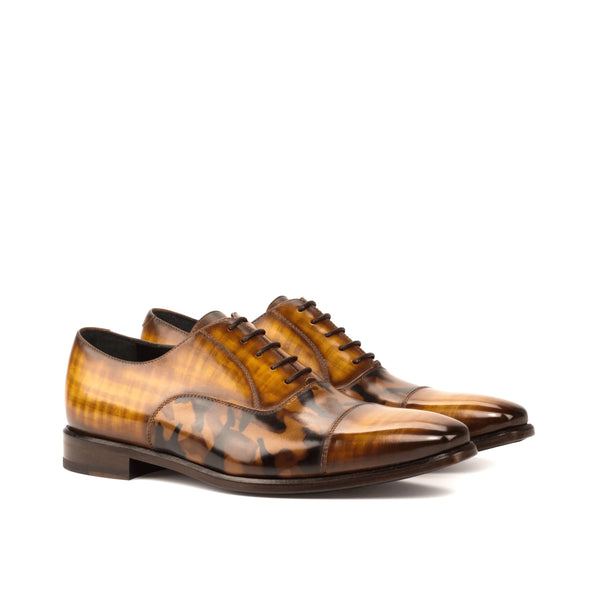 Pair of brown leather Agent Oxford Patina shoes showcasing elegant craftsmanship