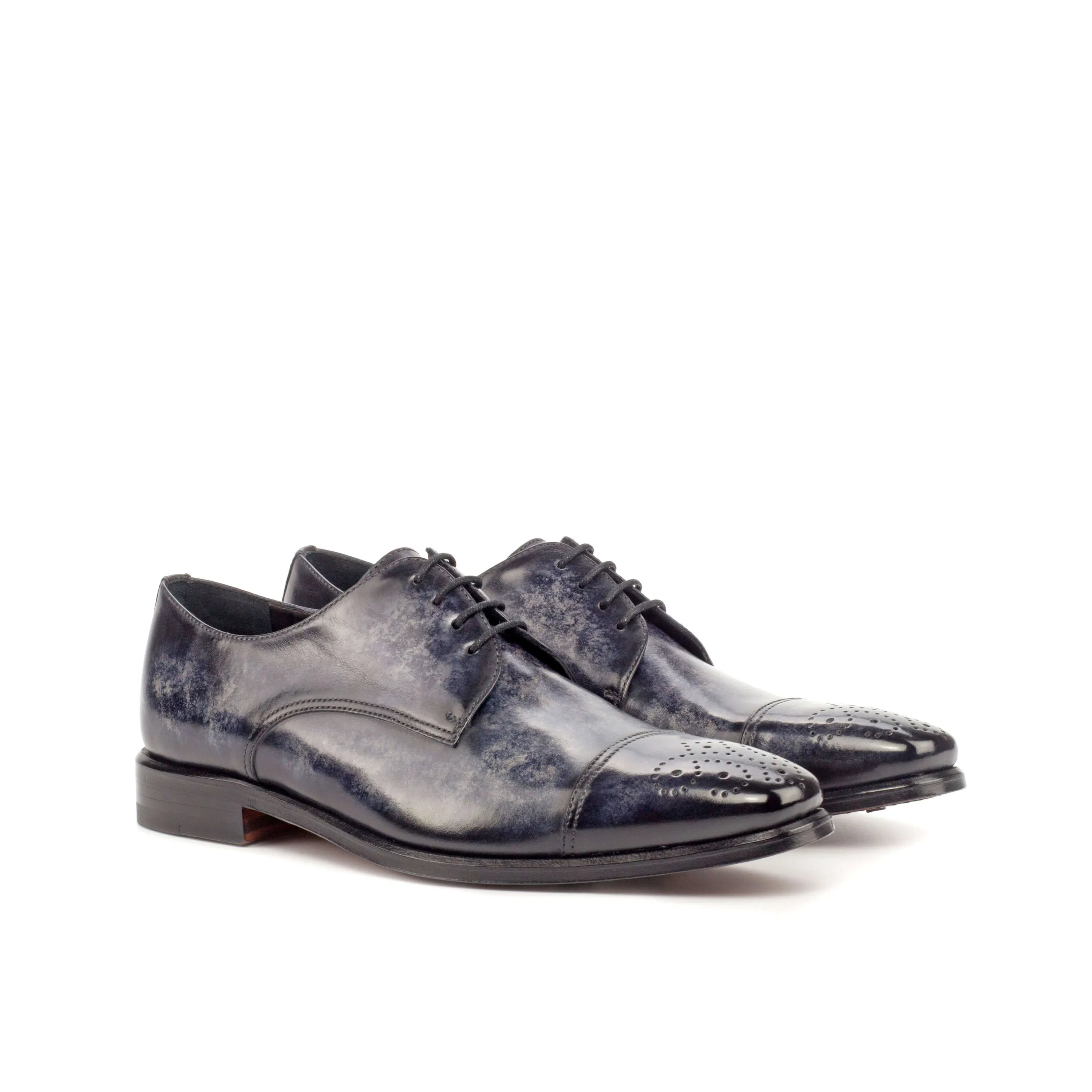 Pair of blue leather AL94 Patina Derby shoes showcasing elegant craftsmanship