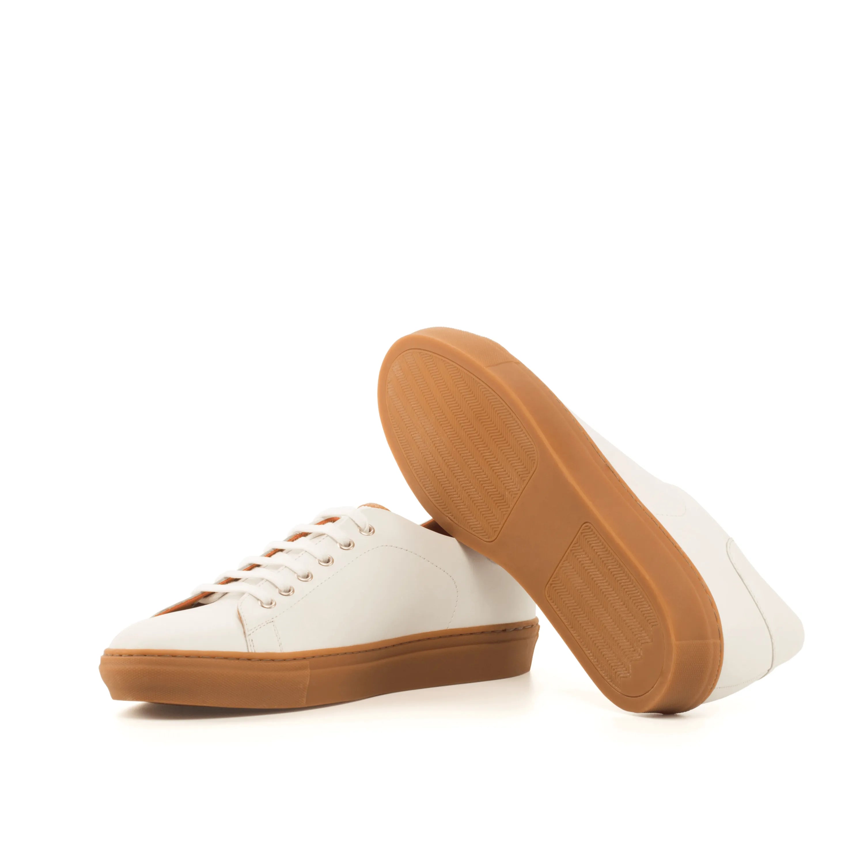 White leather Alon Trainer Sneaker with gum soles, featuring a stylish cupsole design