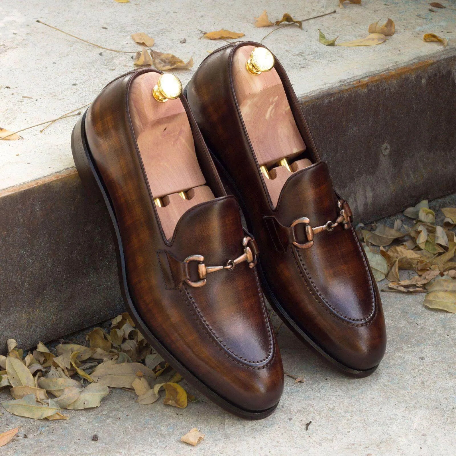 Brown leather horsebit loafers from the Amarelo Patina collection, perfect for stylish wear
