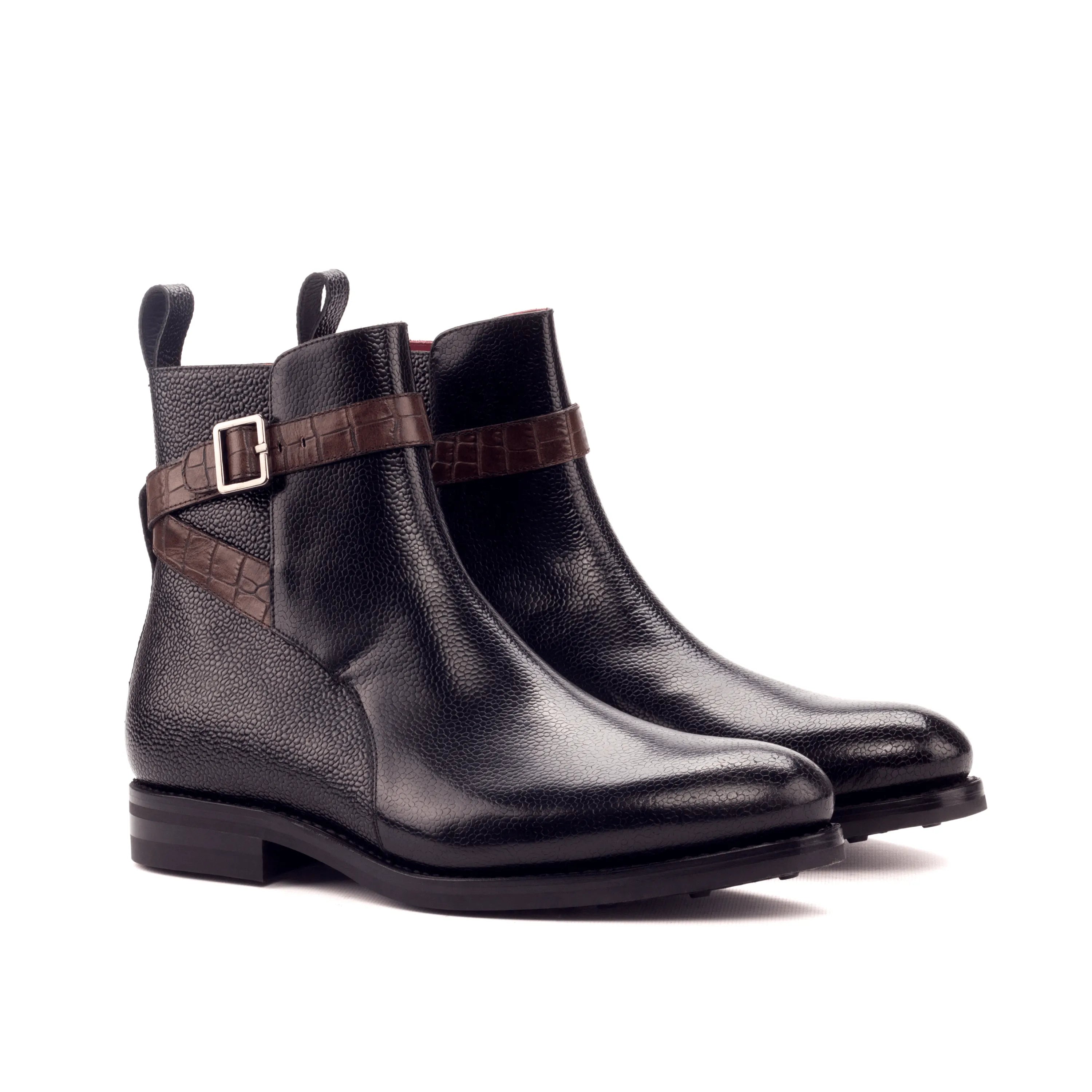 Black leather Anastasio Jodhpur Boots featuring a stylish brown strap detalle