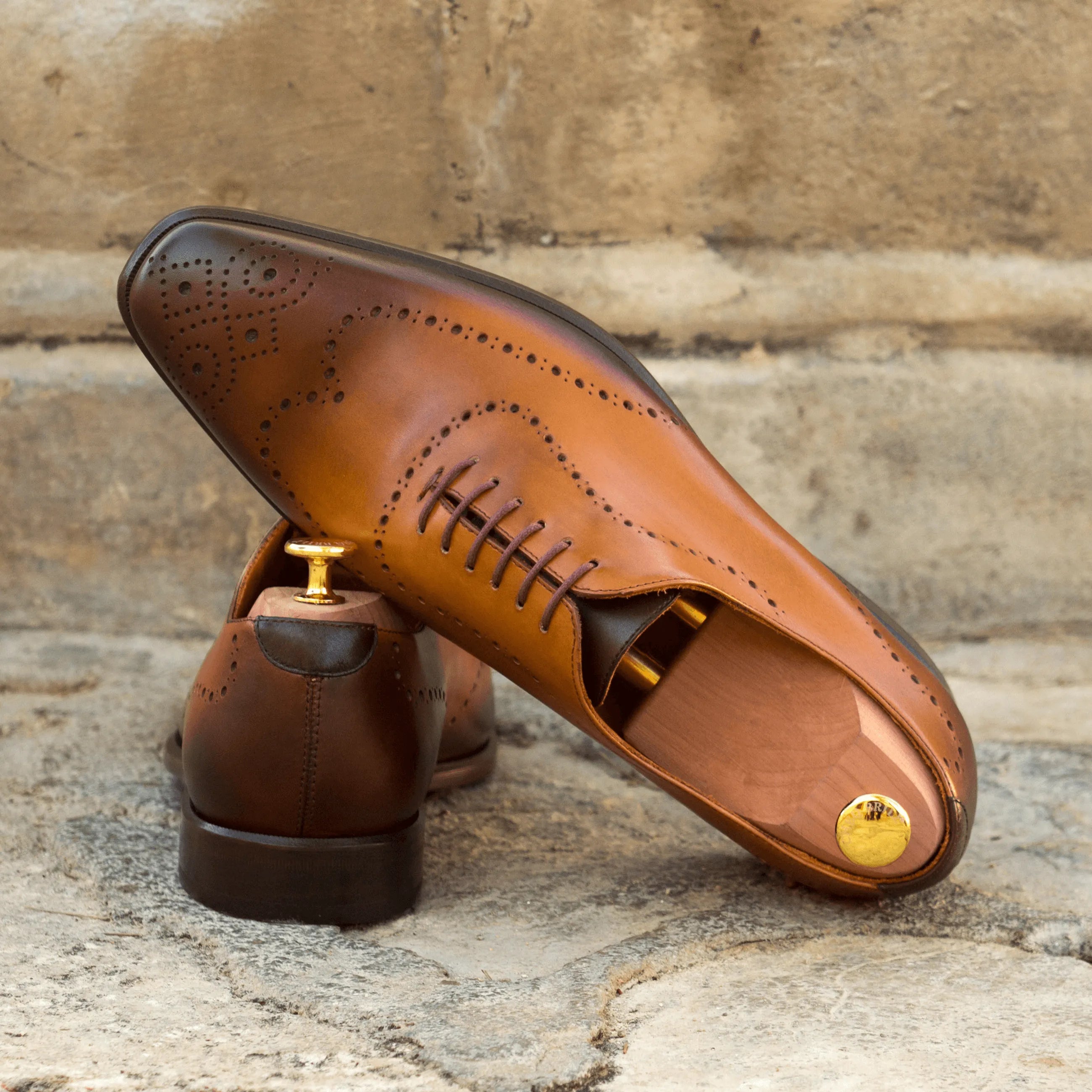 Brown leather dress shoes featuring Andrios Wholecut design for elegant style