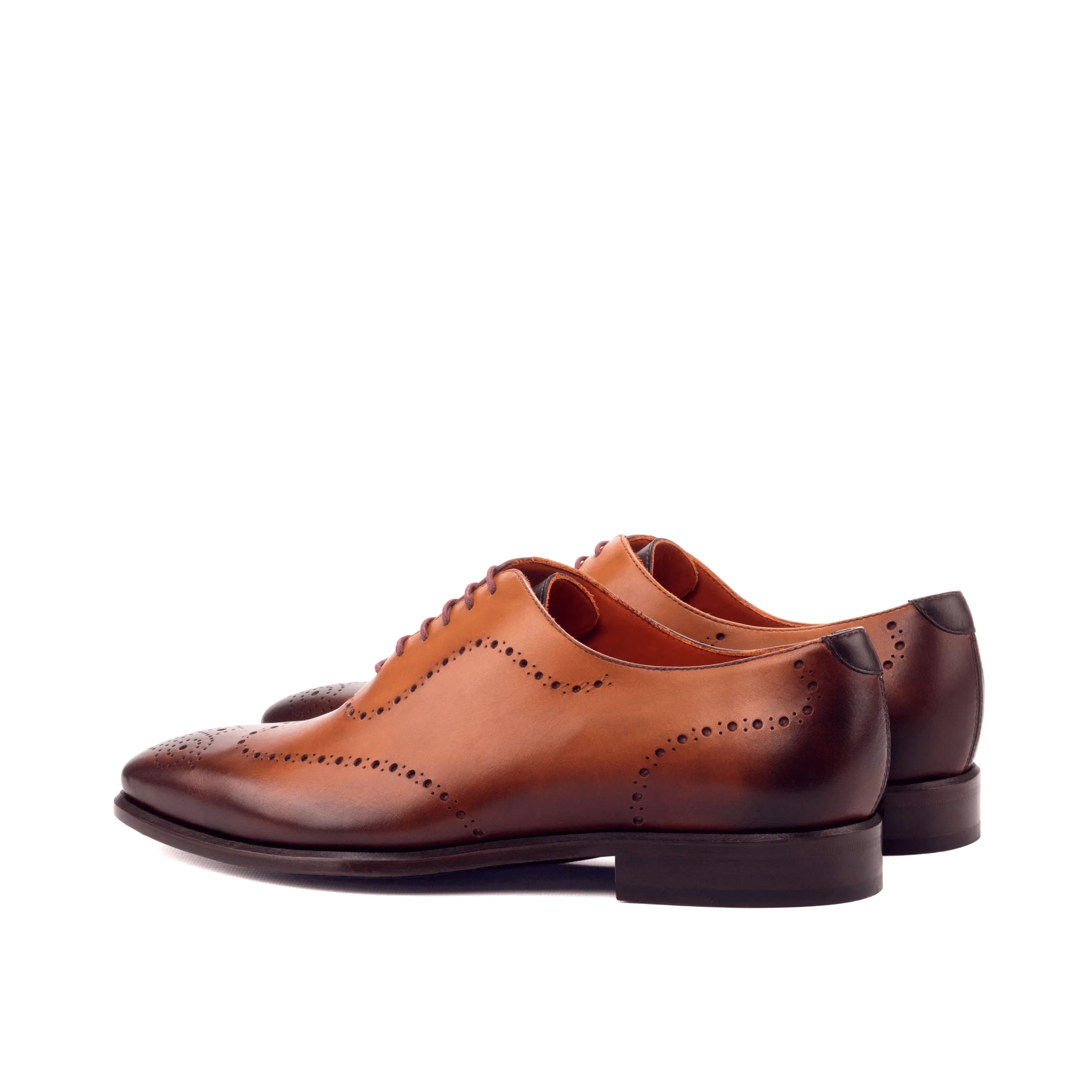 Brown leather dress shoes showcasing Andrios Wholecut Shoes design and craftsmanship