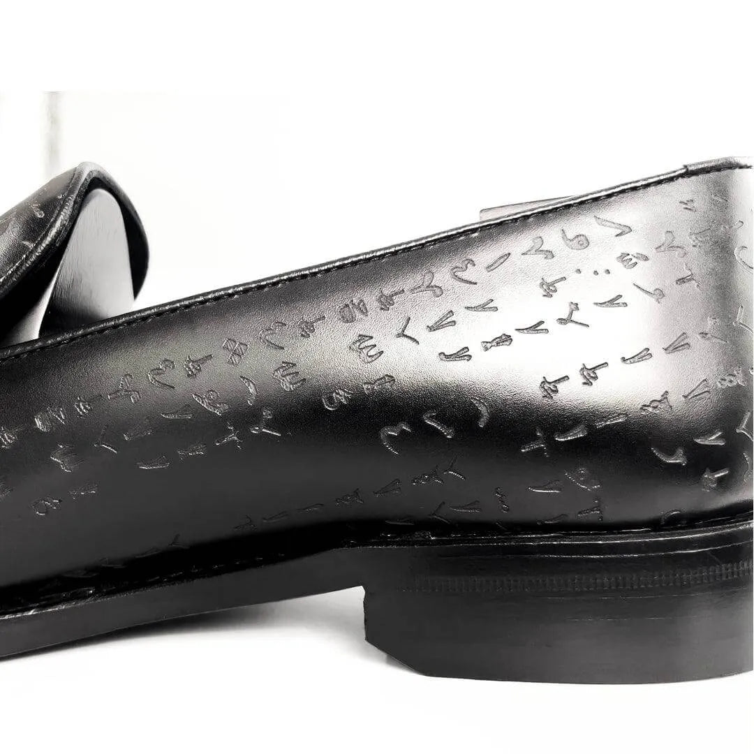 Black leather loafer with embossed symbols, showcasing Italian Crust Leather and Goodyear welted design for Arabic Matrix Loafers
