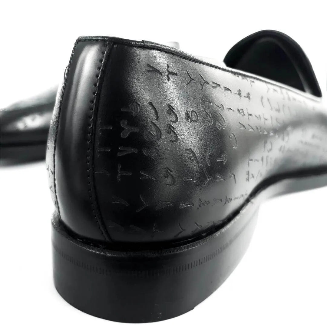 Black leather loafer with embossed symbols, featuring Goodyear welted construction and Italian crust leather