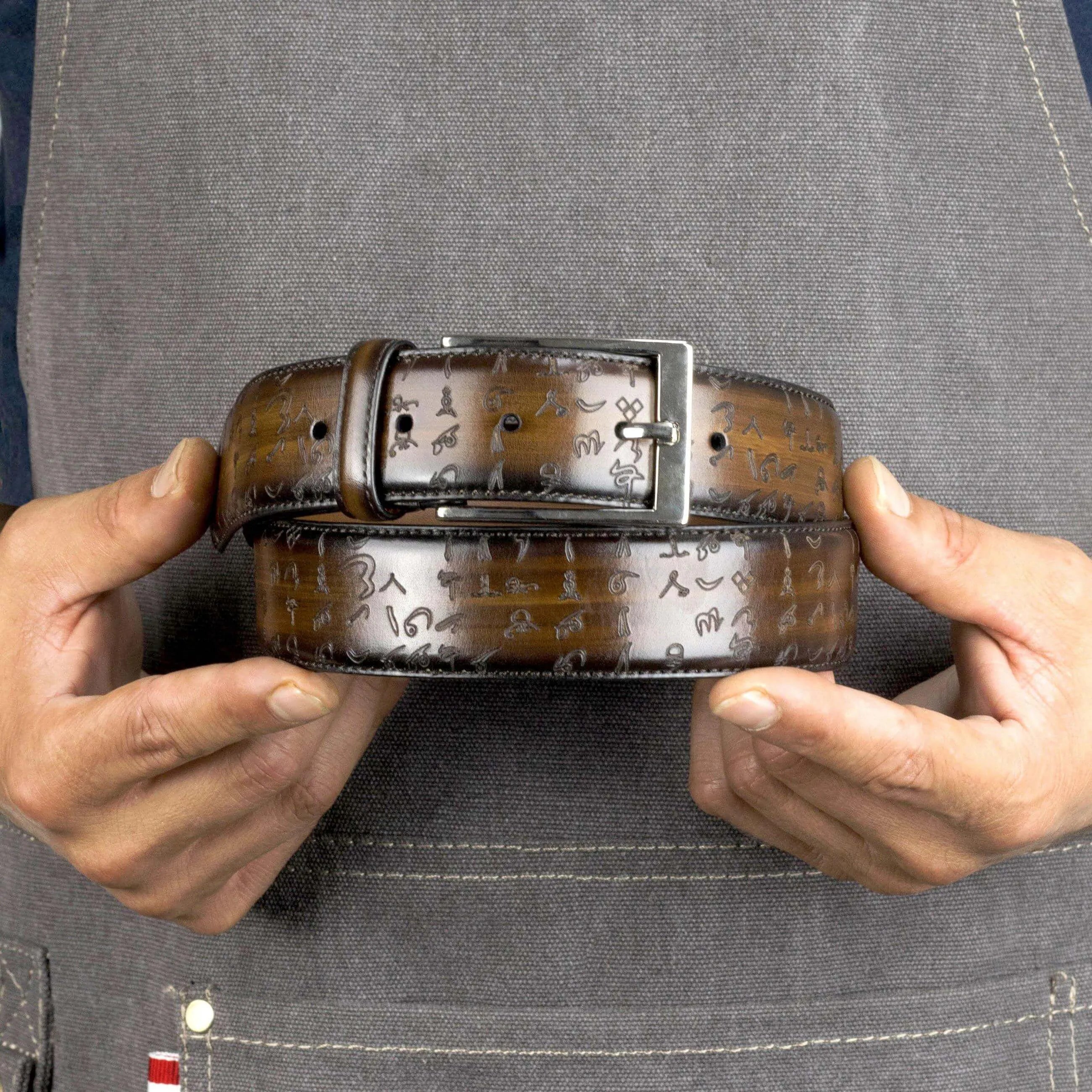 Brown leather Arabic Matrix Patina Hamptons Belt II with silver buckle displayed elegantly
