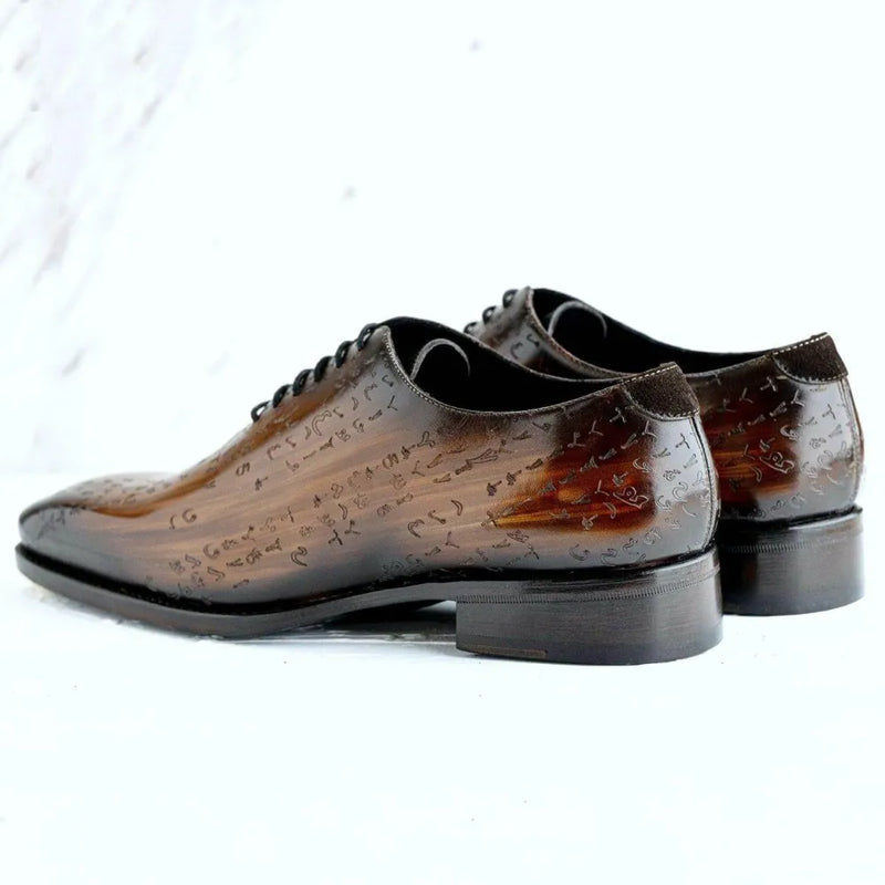 Brown leather dress shoes featuring Arabic Matrix Patina Wholecut design in Italian crust leather