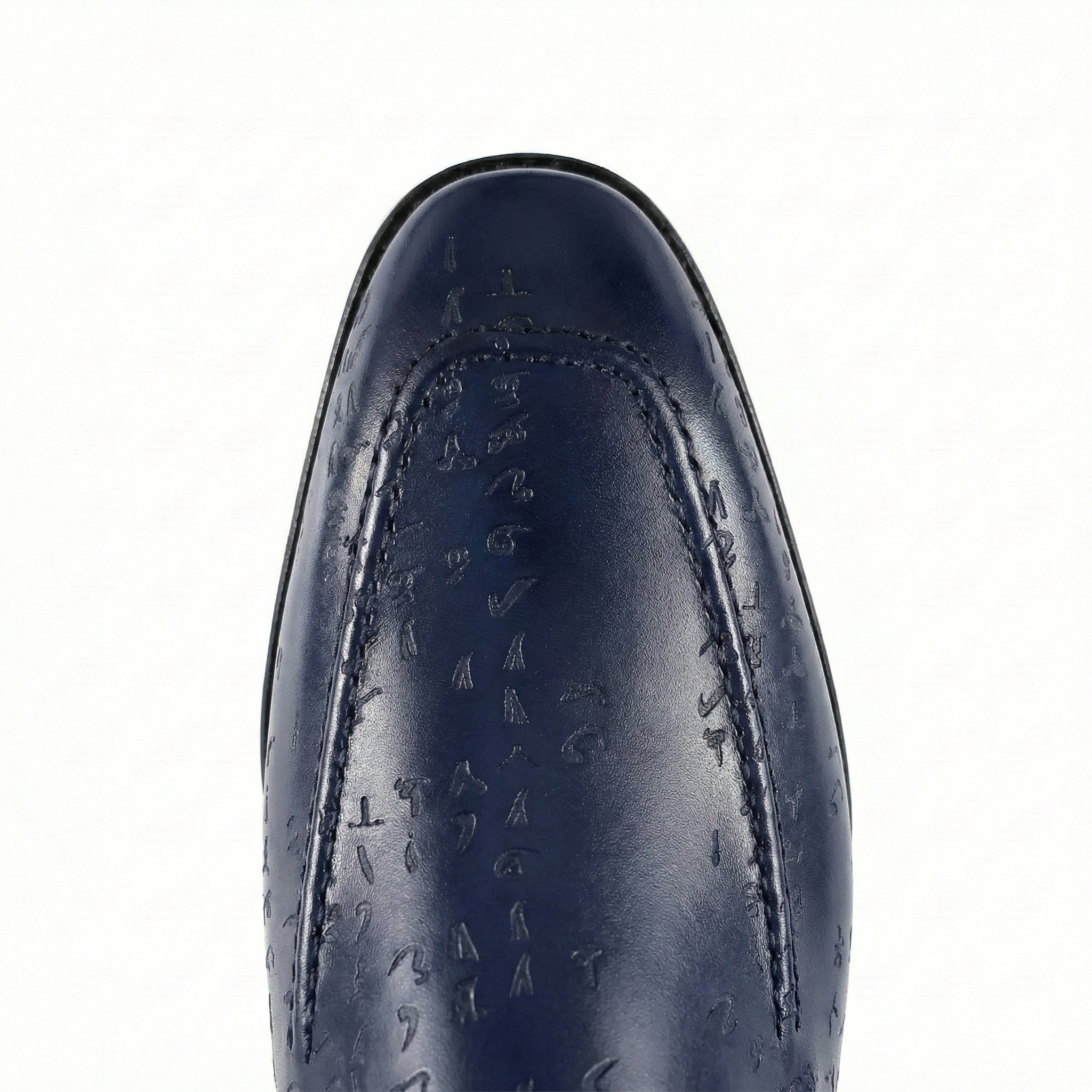 Close-up of a navy blue leather shoe on a white background