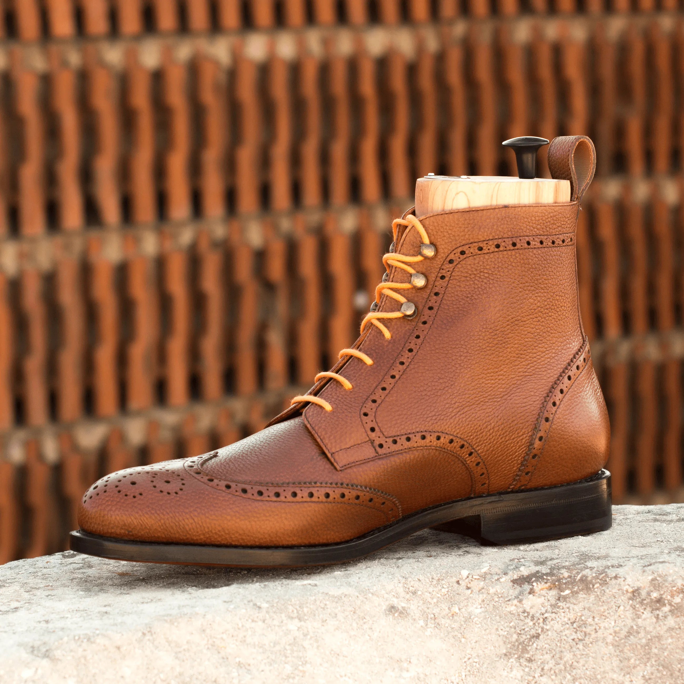 Brown leather wingtip boot featured in Aram Military Brogue Boots collection