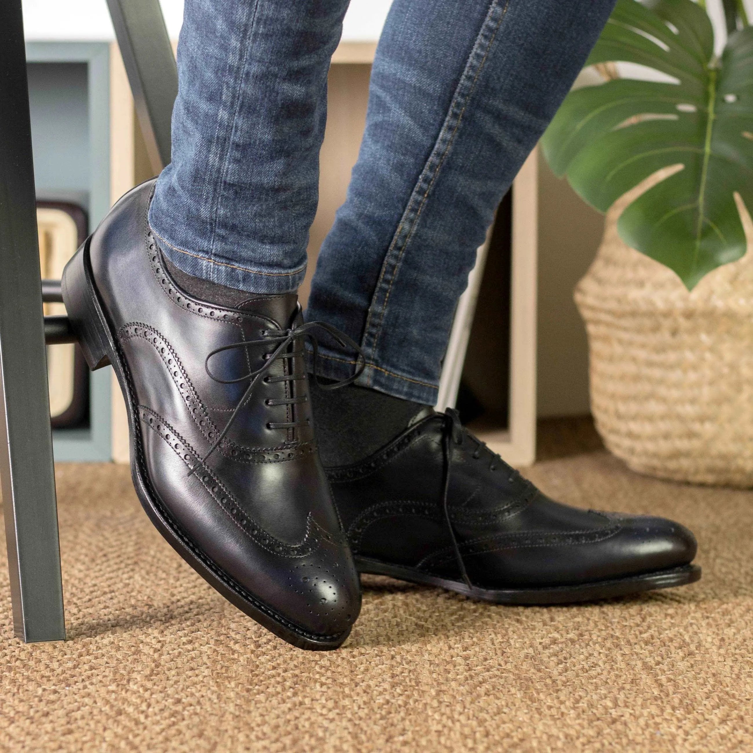 Black leather Aurora Longwing Blucher shoes featuring a classic wingtip design