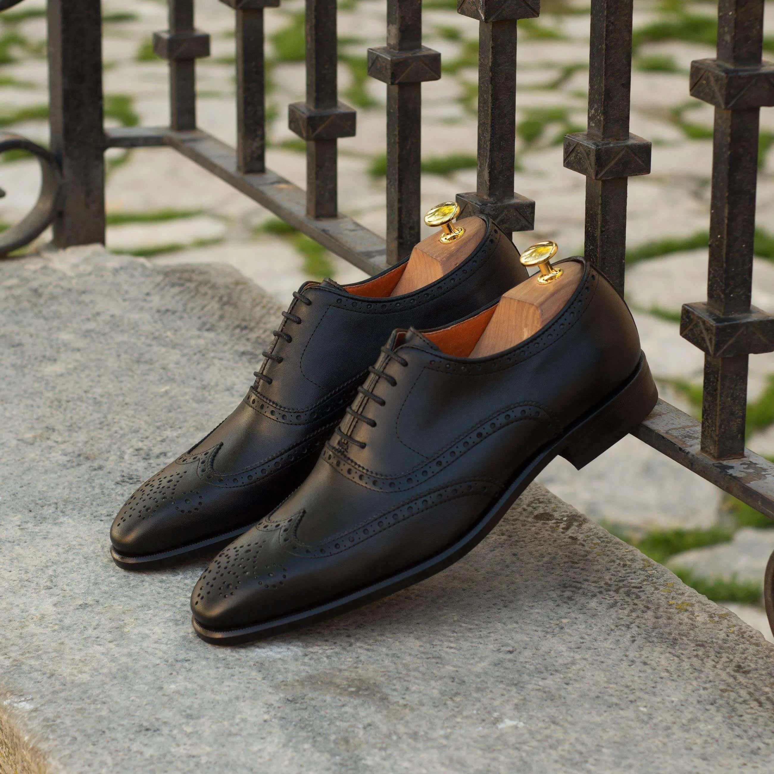 Pair of black leather brogue shoes from Awan Full Brogue shoes II, luxury bespoke shoes for men