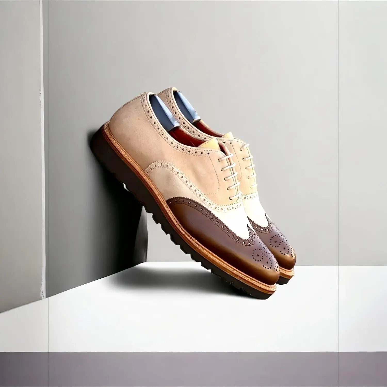 Curating luxury footwear collections: beige and brown patina brogue oxfords