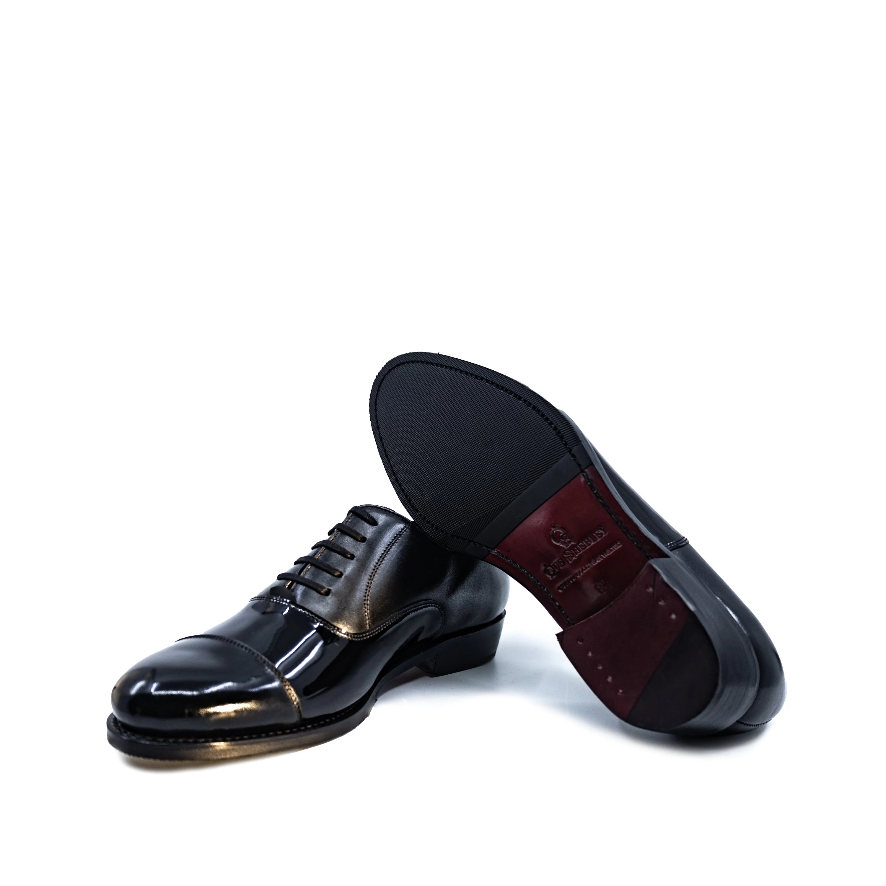 Beyondz Oxford Shoes II: black patent wingtip with gold accents