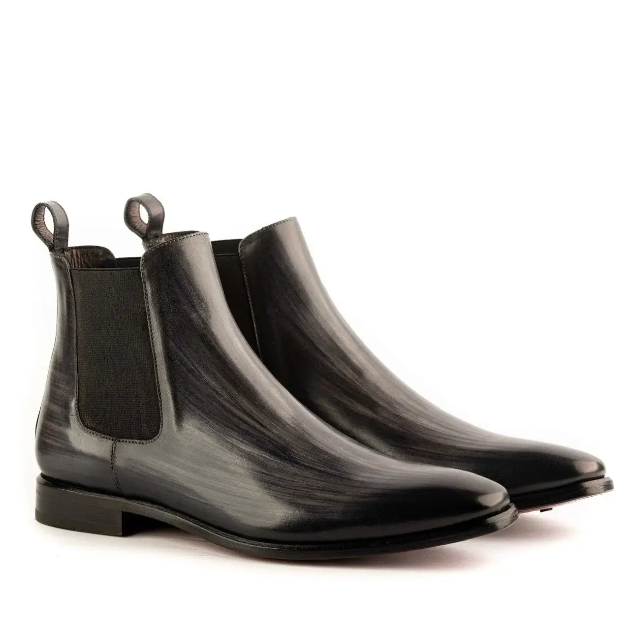 Elegant black leather chelsea patina boots with polished finish and elastic panels
