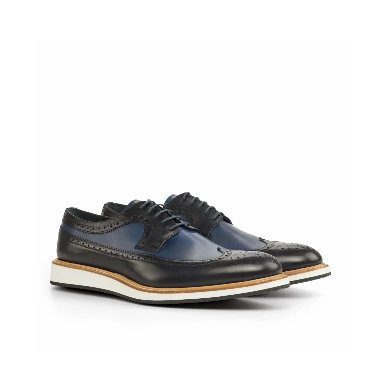 Elegant black and navy brogue shoes in bespoke tailoring appreciation