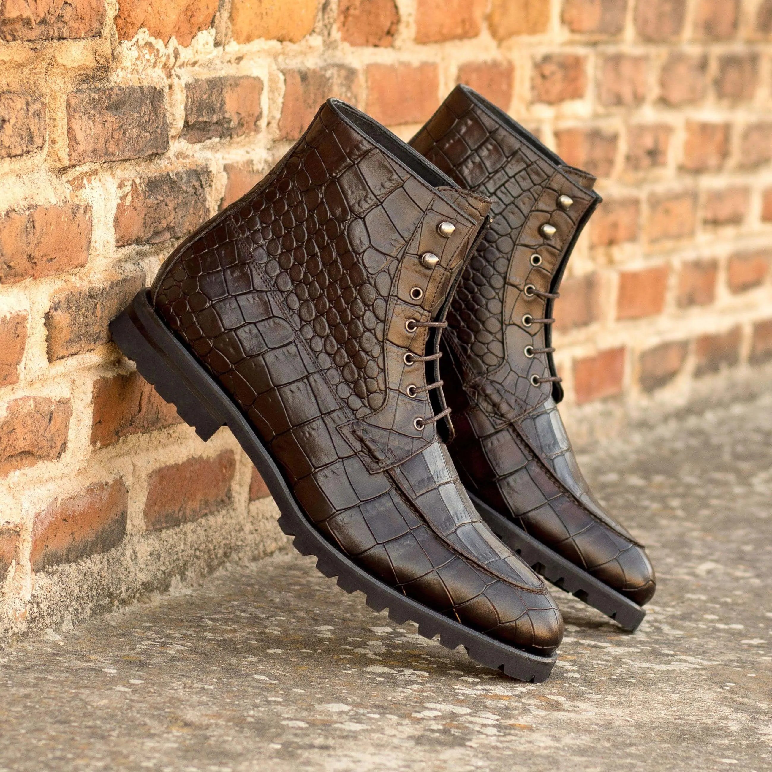 Pair of brown crocodile leather Bonny Moc Boots showcasing elegant craftsmanship