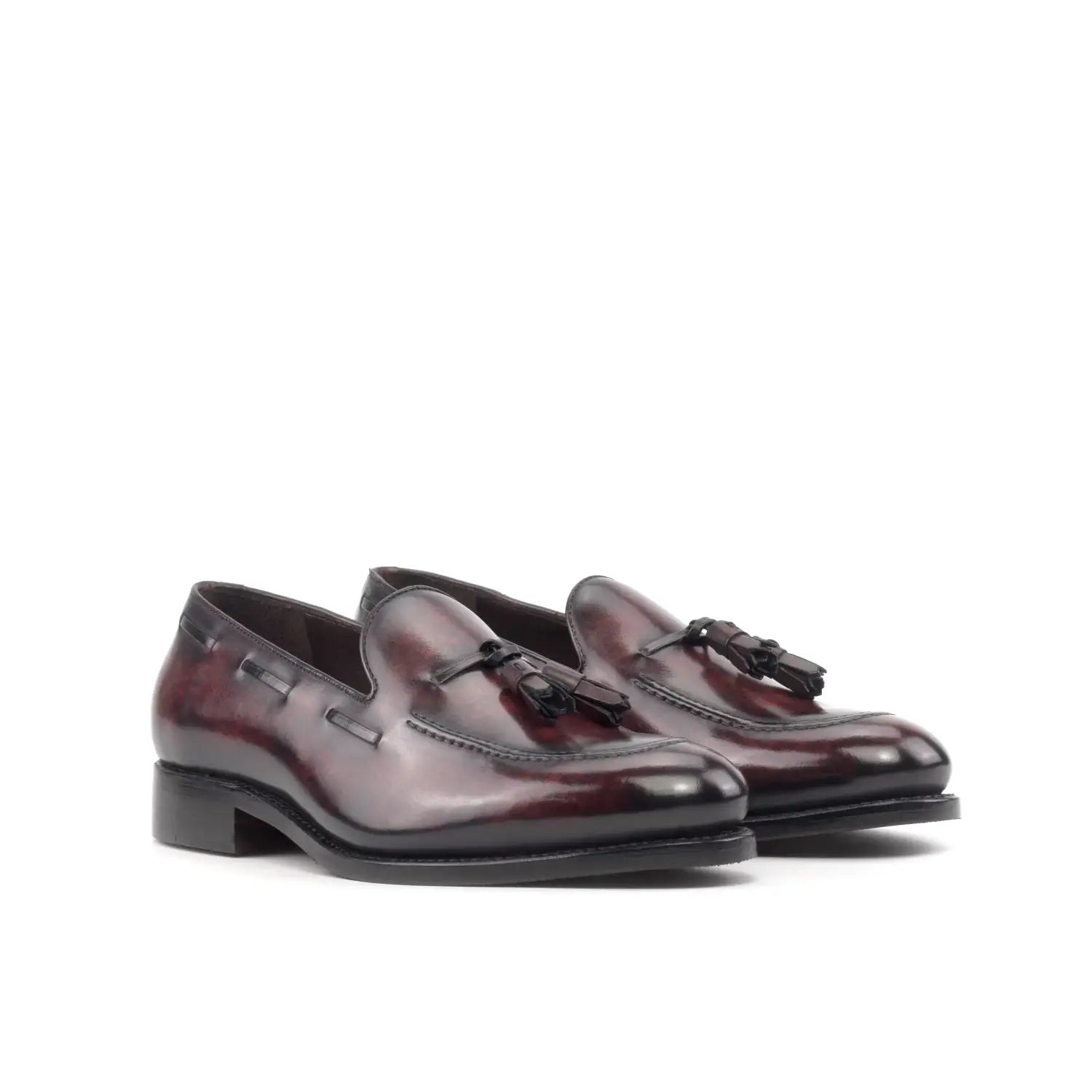 Classic burgundy tassel loafers with black soles and tips for autumn elegance.