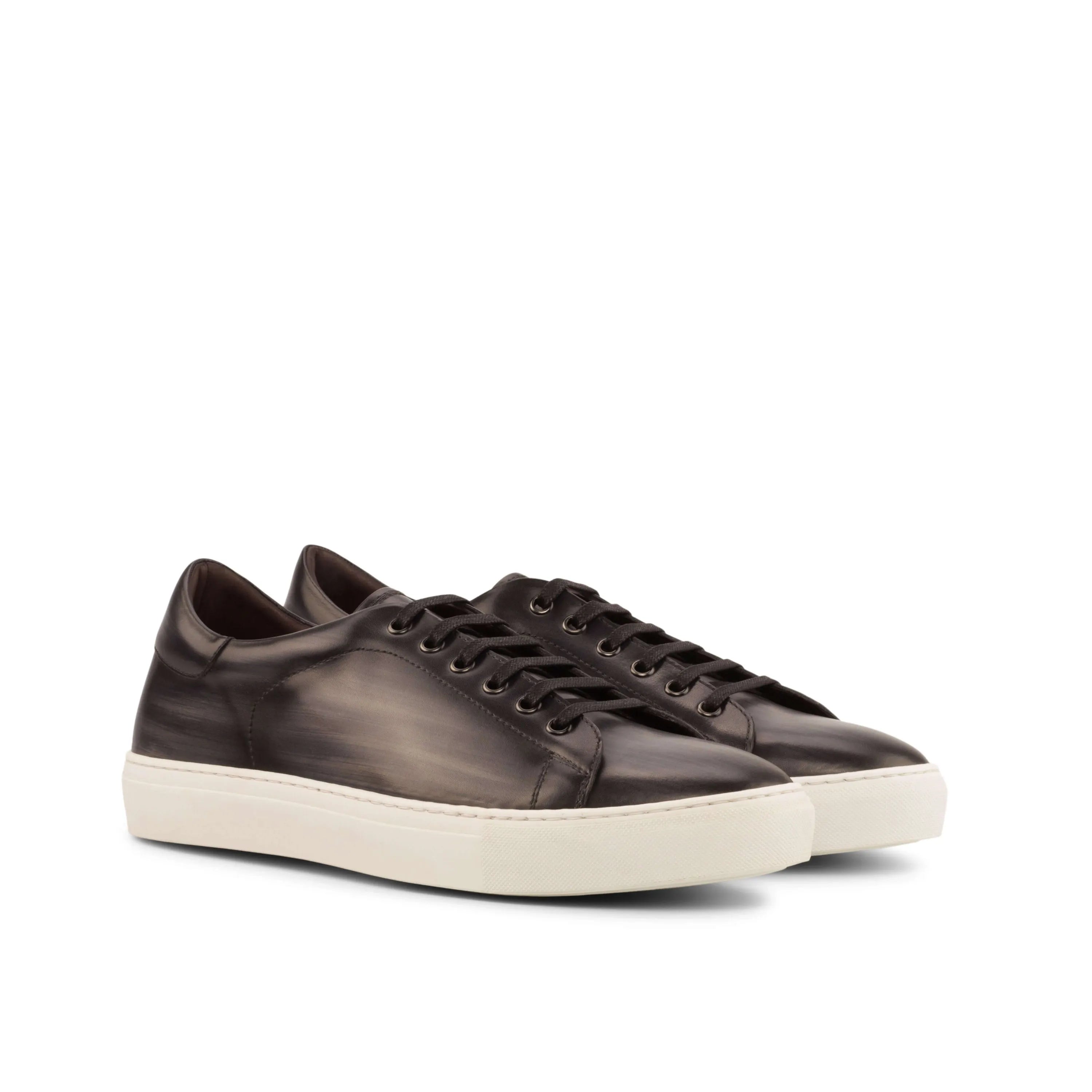 Pair of black leather C68 Trainer Patina Sneakers with cupsole design for stylish comfort