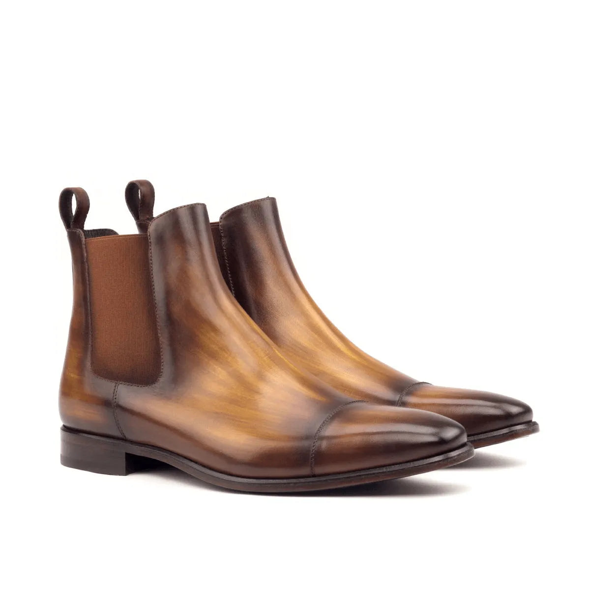 Brown leather Caratacos Patina Chelsea Boots showcasing elegant craftsmanship and style