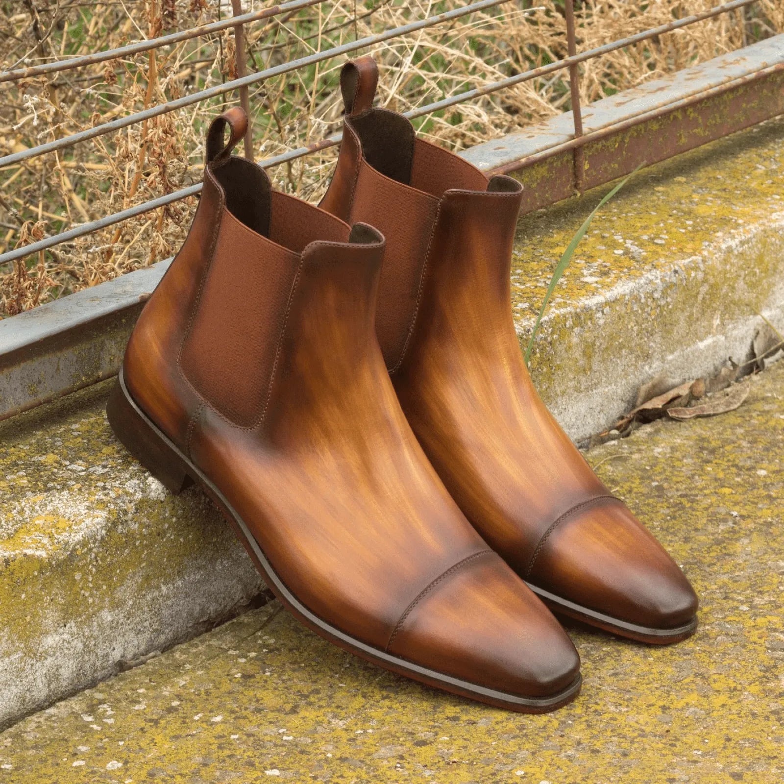 Brown leather Caratacos Patina Chelsea Boots showcasing elegant patina finish