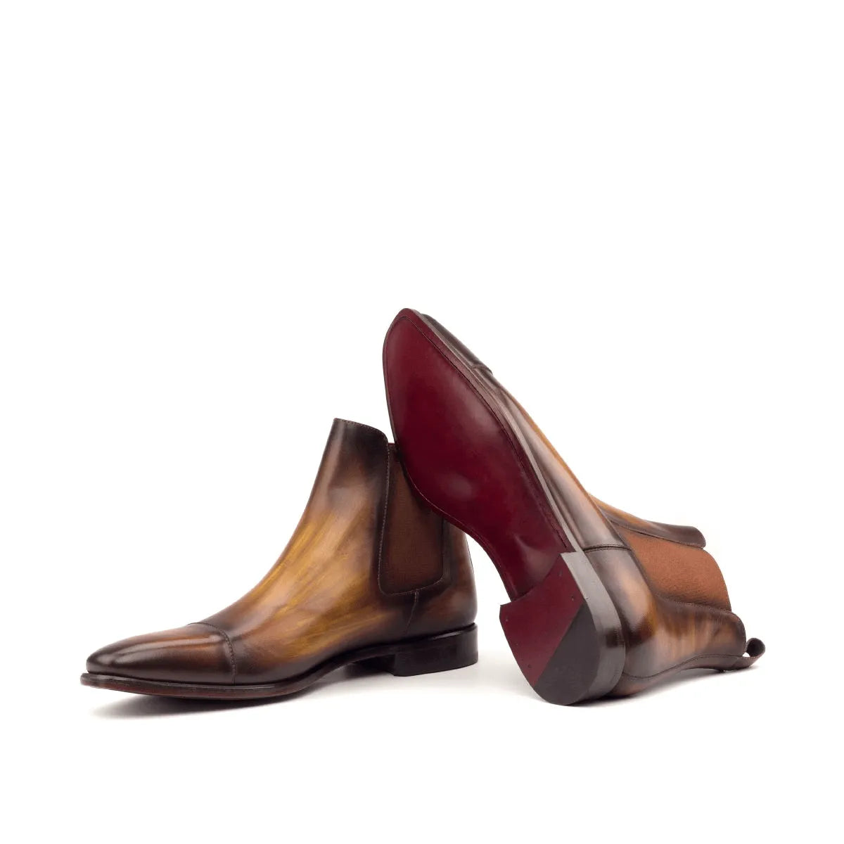 Two brown leather Caratacos Patina Chelsea boots elegantly displayed for purchase