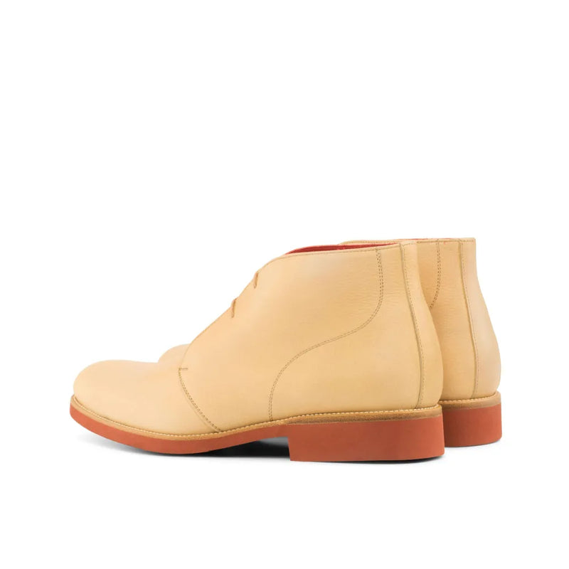 Tan leather Castellos Chukka boots elegantly displayed for stylish footwear choices