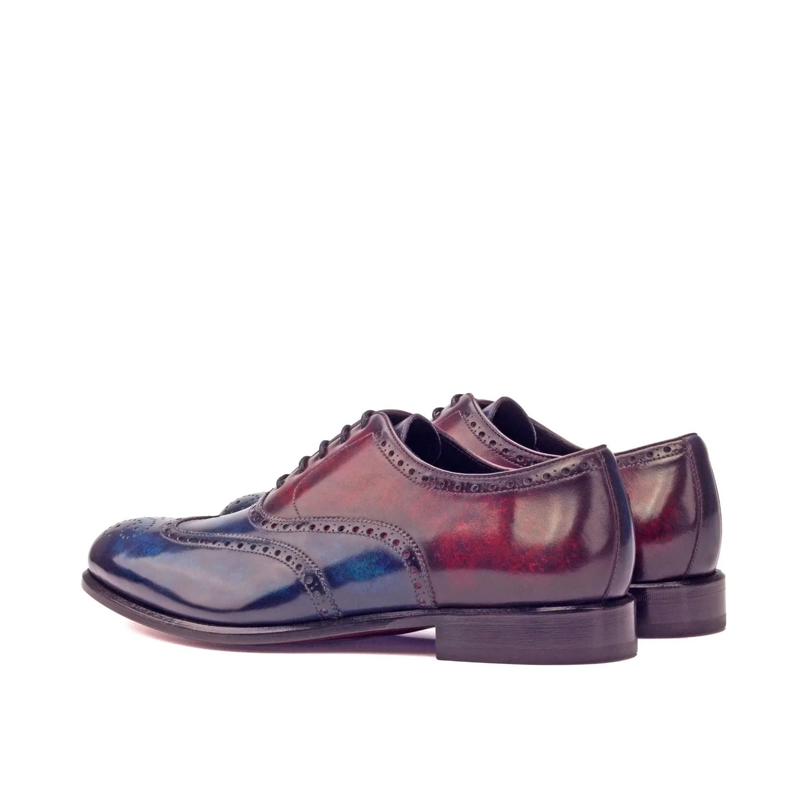 Two-toned leather wingtip dress shoes, the Celestial Patina Longwing Blucher in focus