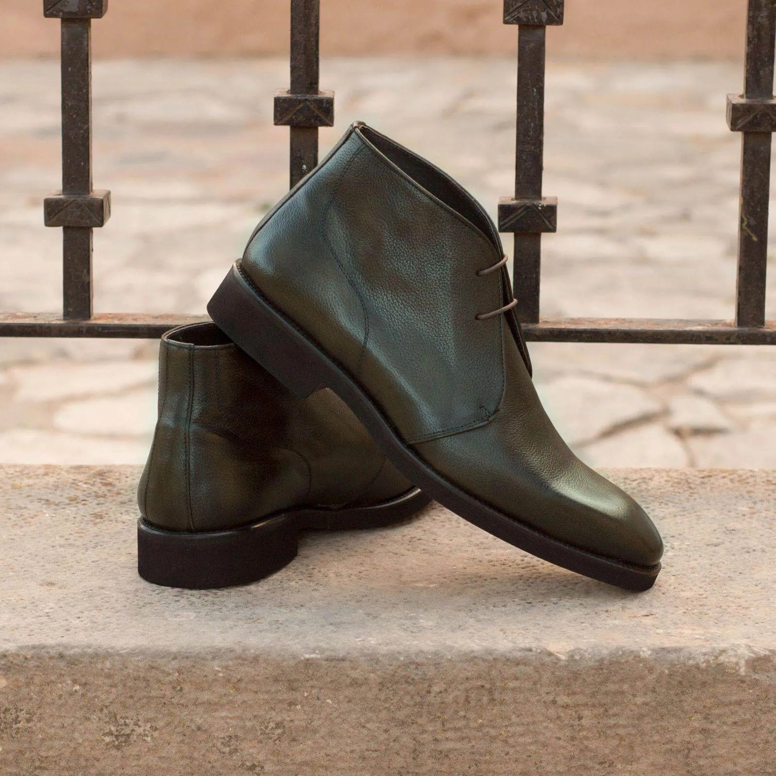 Olive green leather Chesmu Chukka boots displayed elegantly as chukka boots