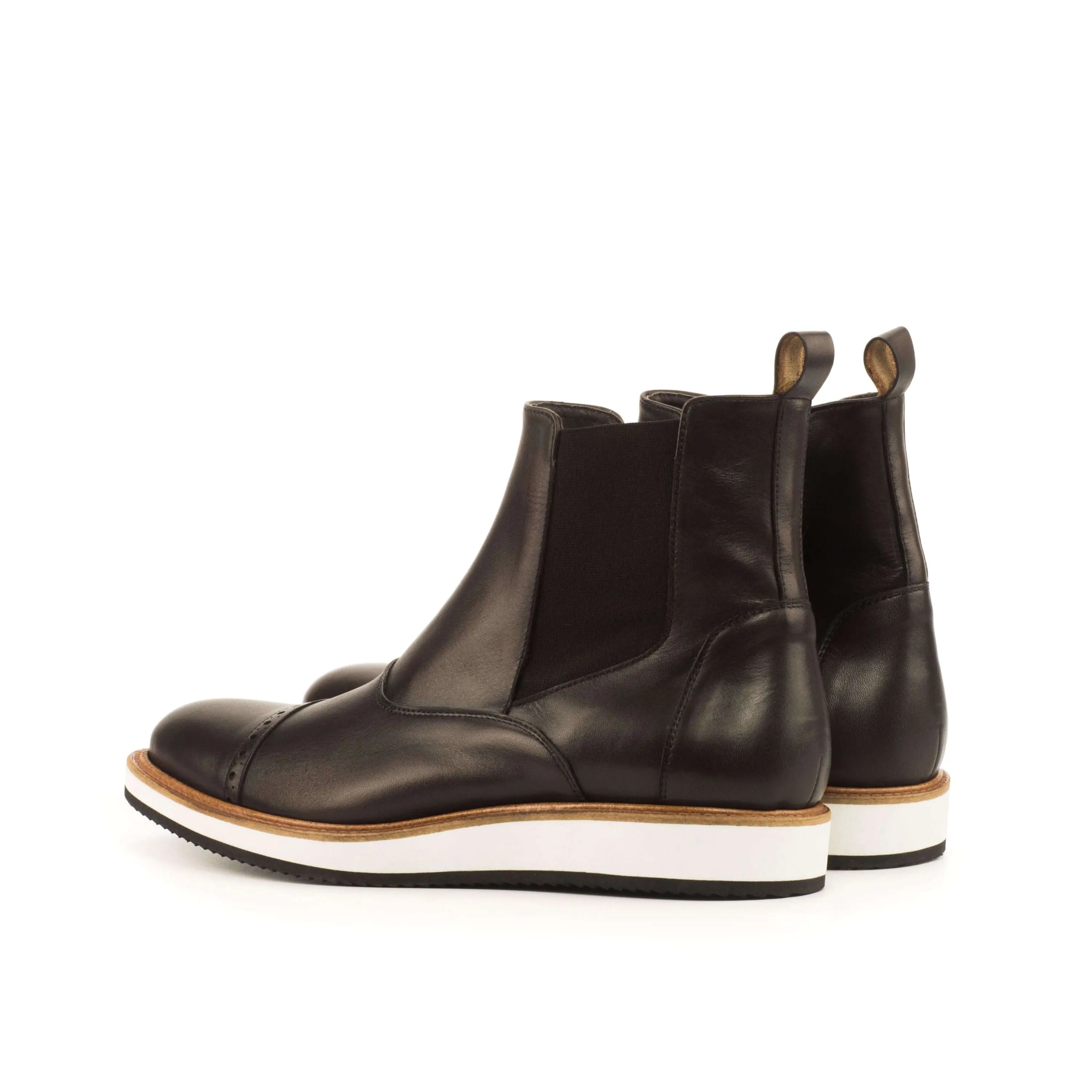 Black leather Choovio Chelsea Boots featuring a classic design for versatile style