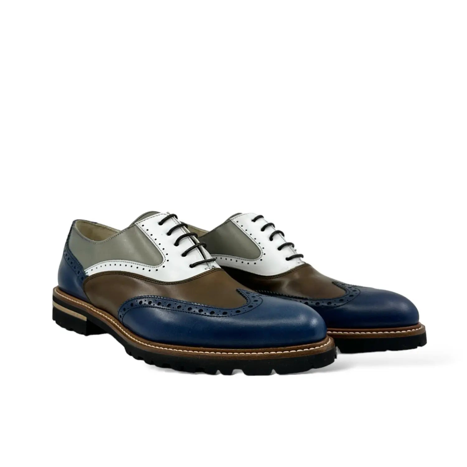 Classic navy blue Poet VIII patina wingtip oxford shoes with white laces.