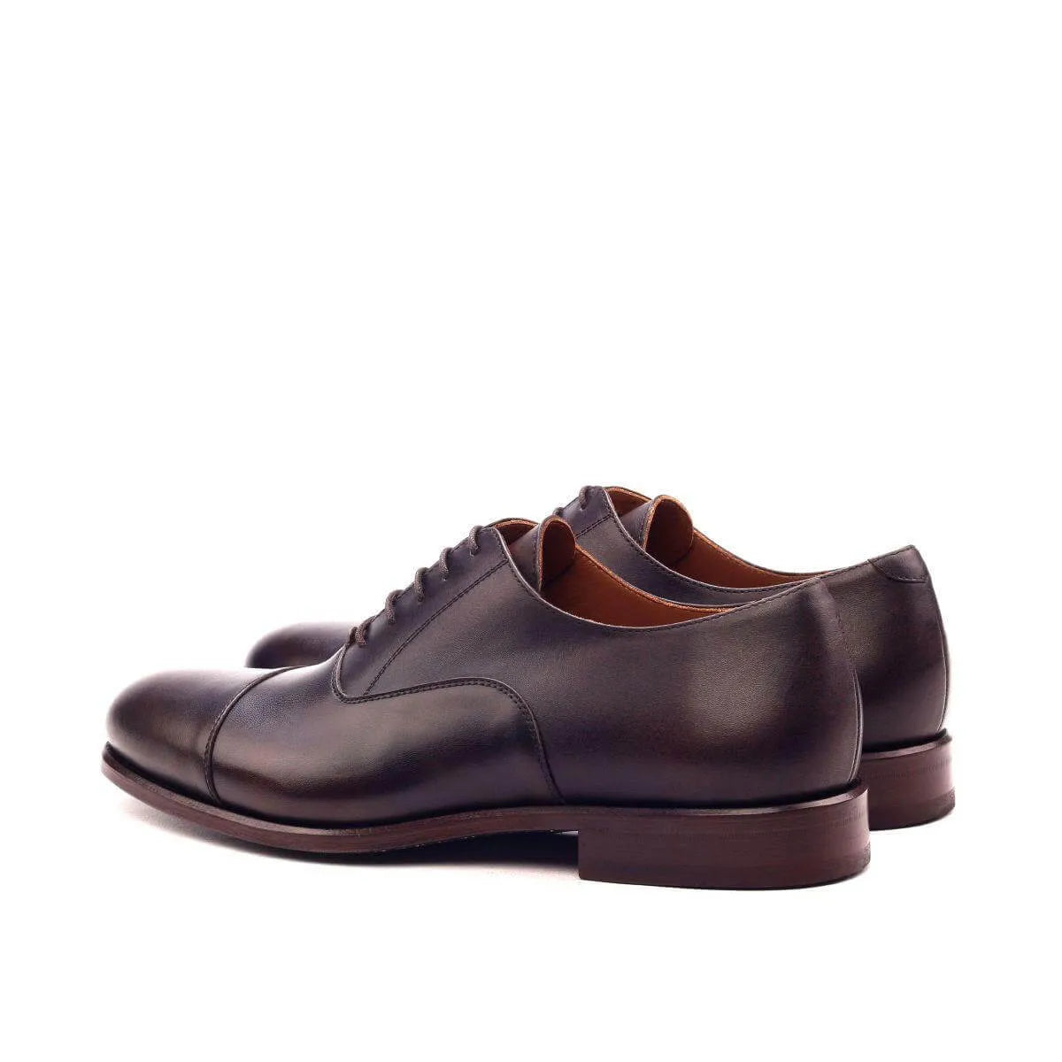 Pair of brown leather Classico Oxford Shoes displayed elegantly for formal occasions