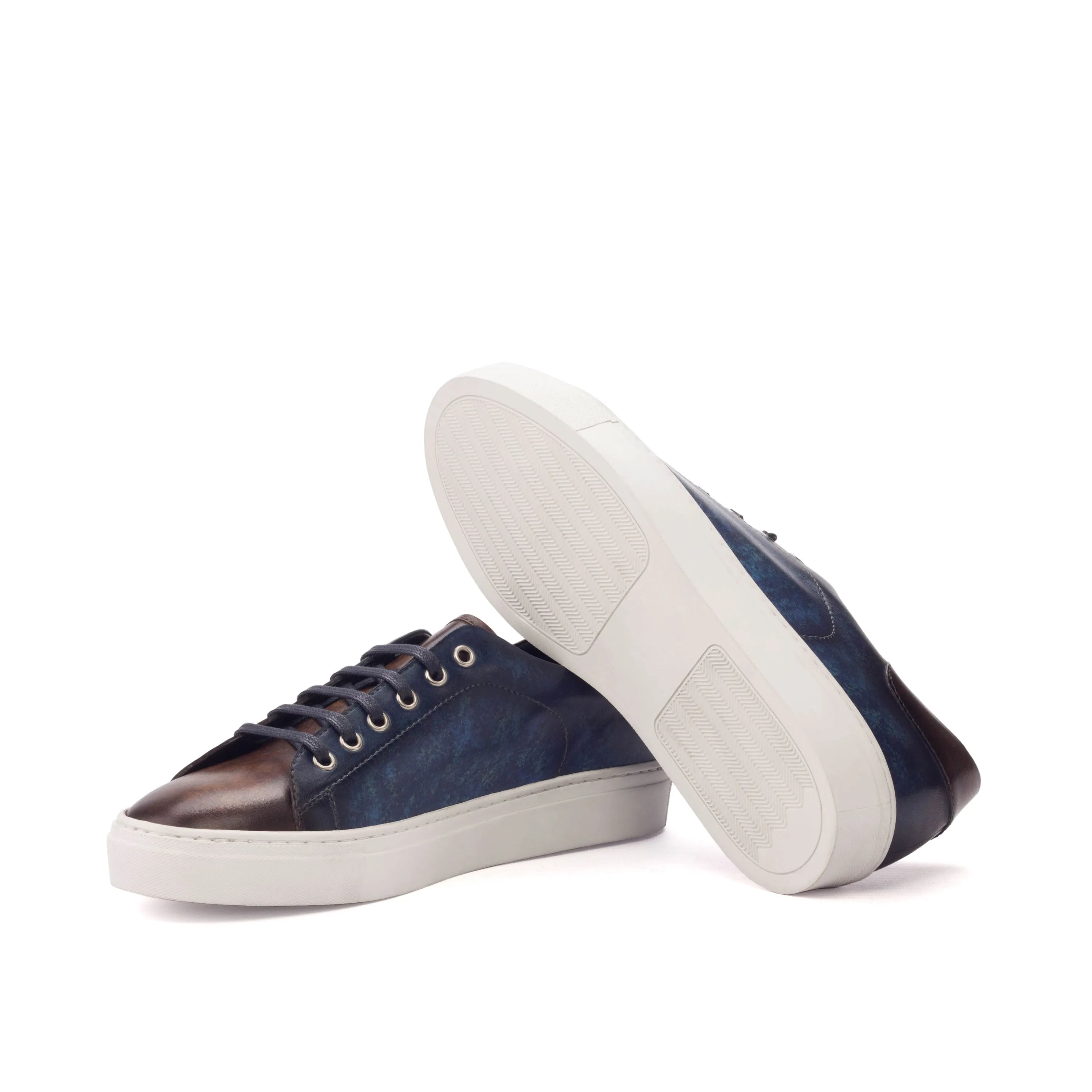 Two-tone leather sneakers, showcasing the Cyprian Trainer Patina design for stylish wear