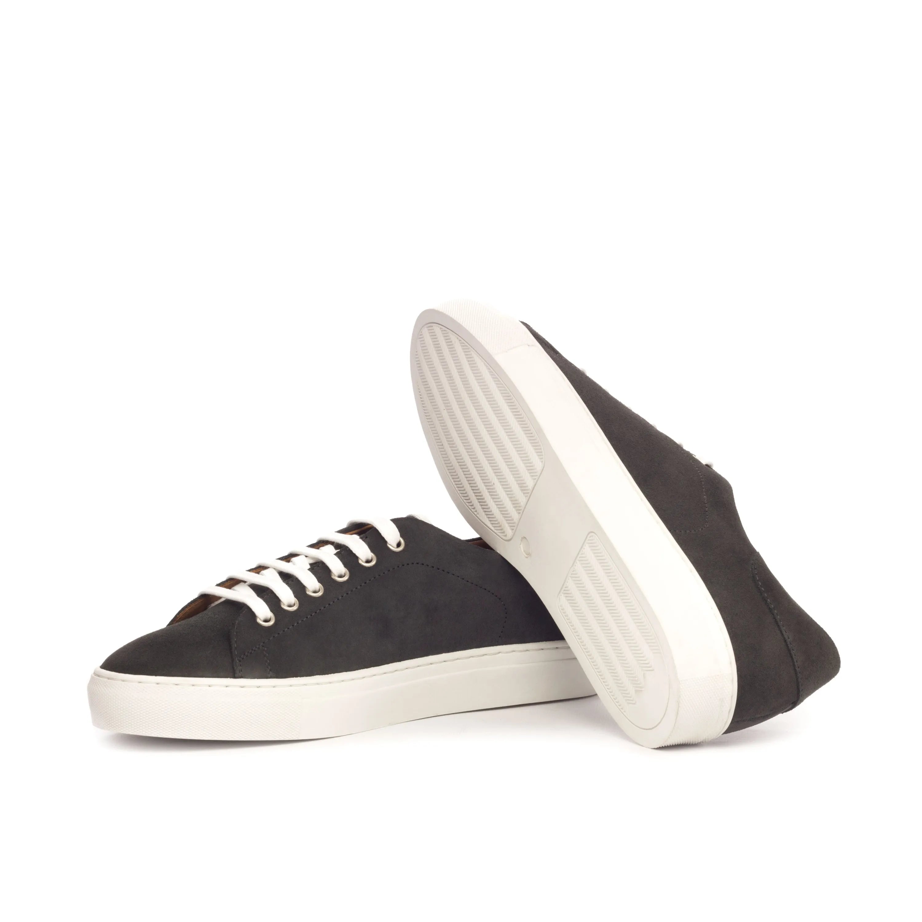 Black Dailama Trainer Sneakers featuring white soles and laces, perfect for casual wear