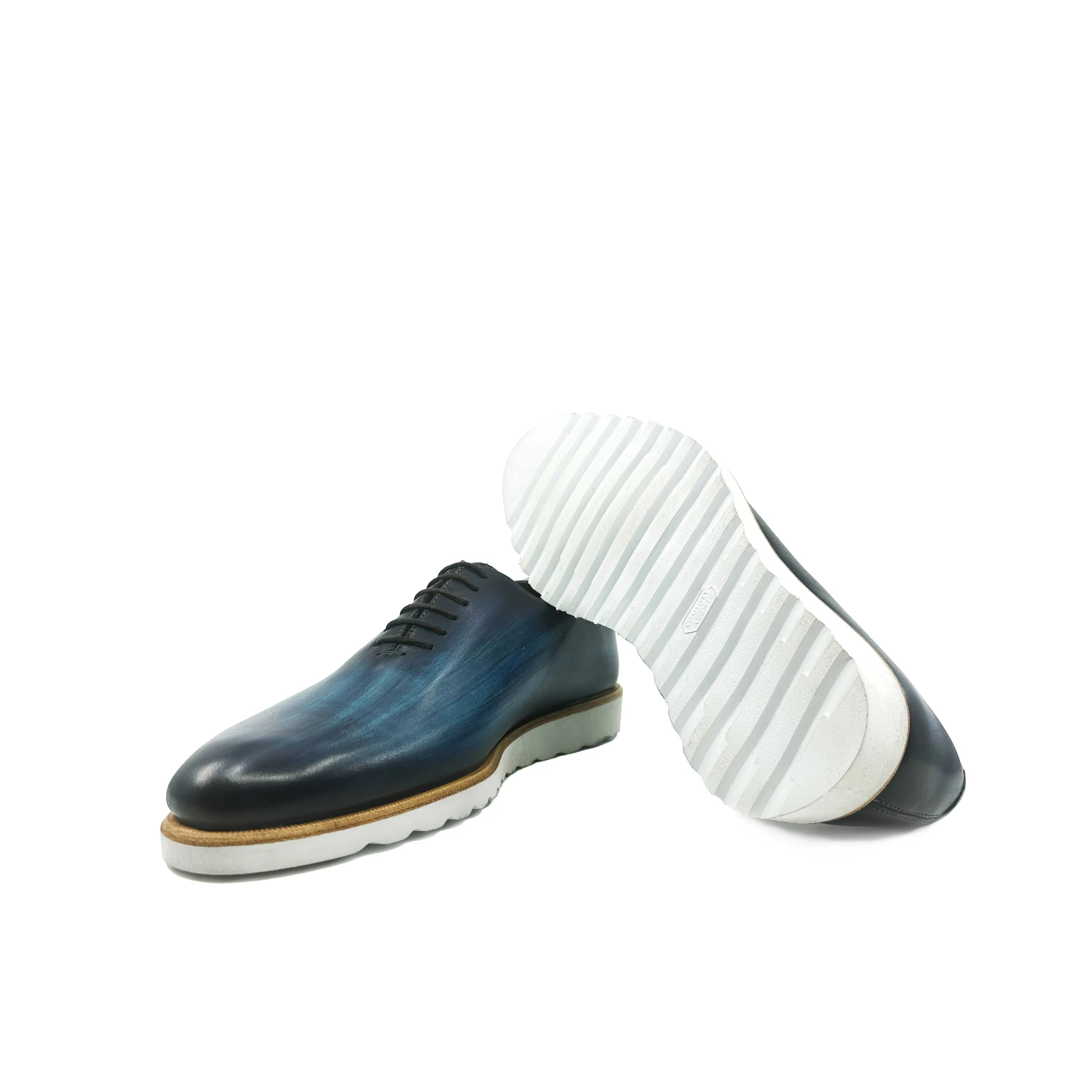 Blue leather Danny Patina Wholecut dress shoes with stylish white soles