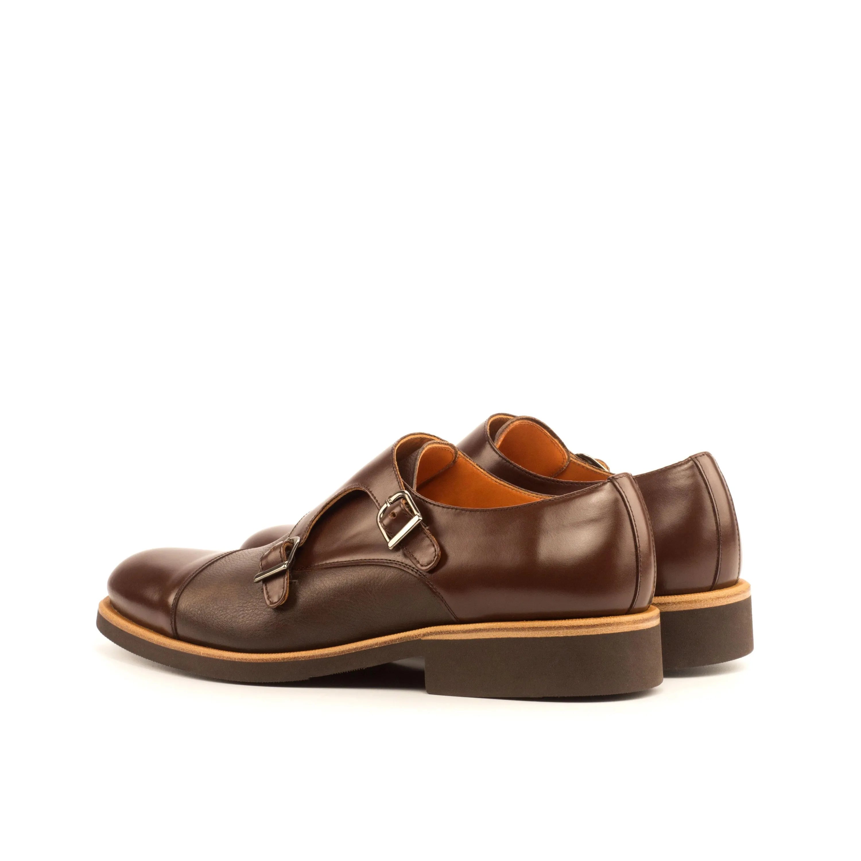Pair of brown leather DMC Double Monk II shoes featuring a rounded toe design