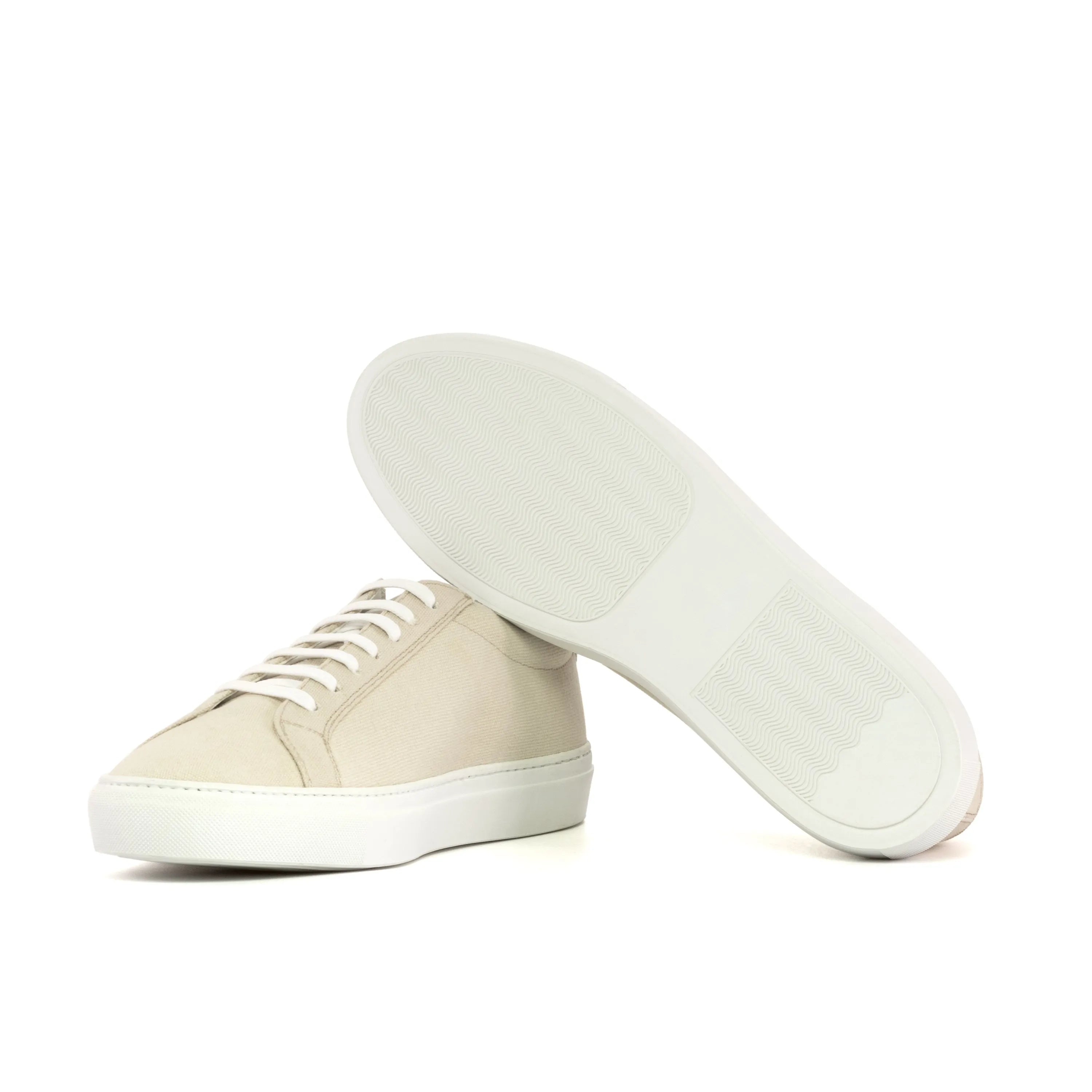 Beige leather Donni Low Kick Vegan Sneaker showcasing stylish and sustainable footwear