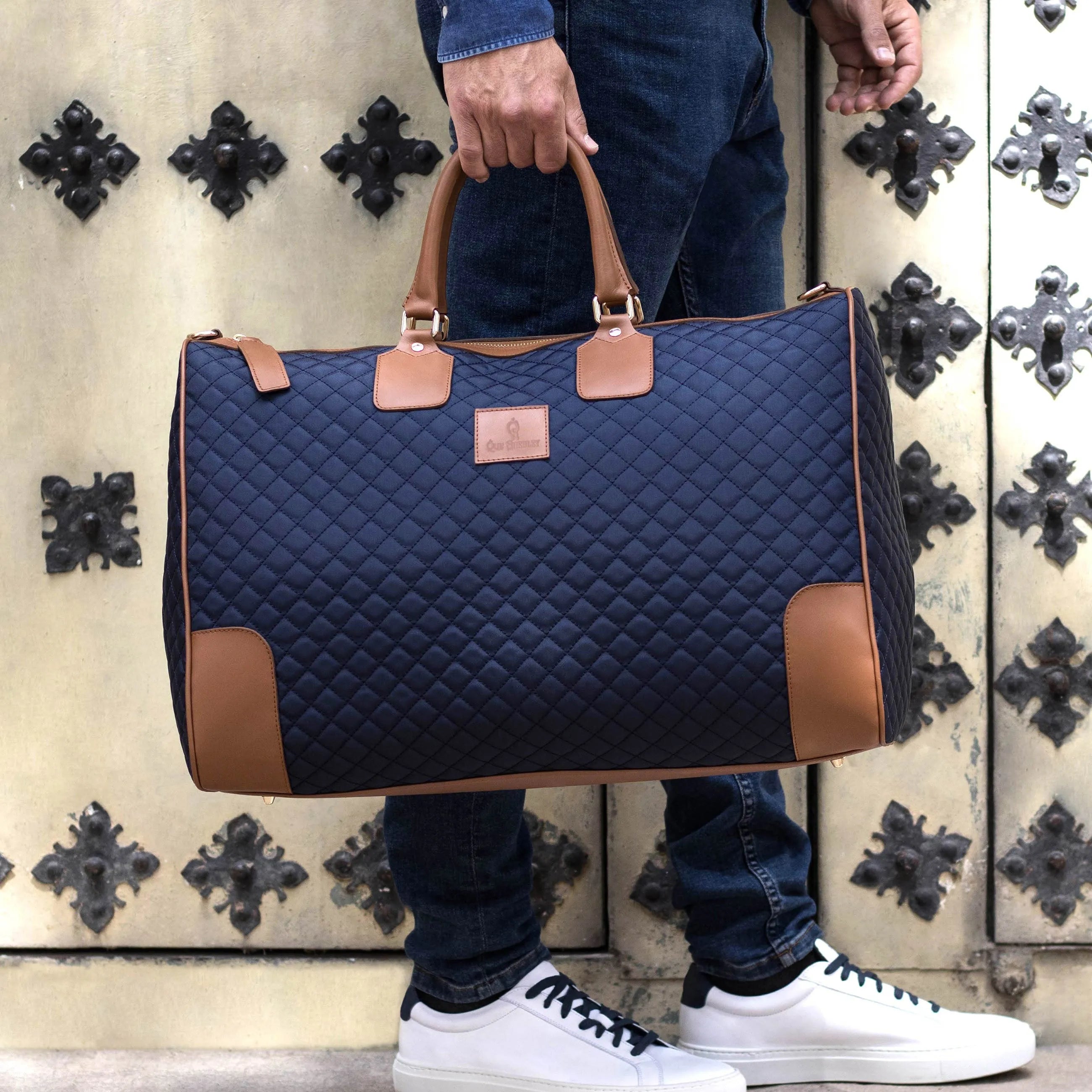 Quilted navy and tan duffel bag from the Donostia Weekender collection