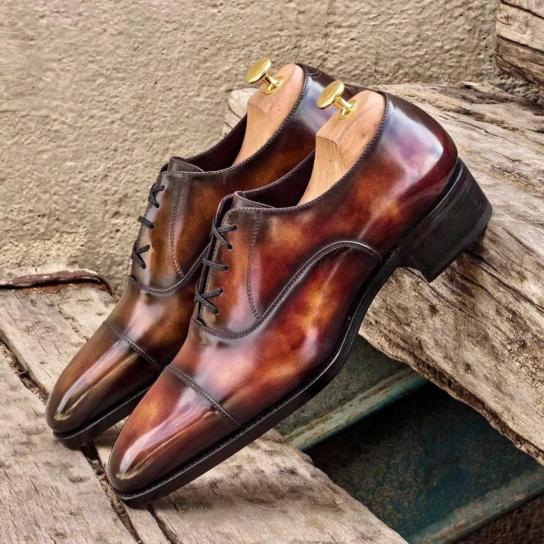 Pair of brown leather Doublagent oxford patina shoes for elegant formal wear