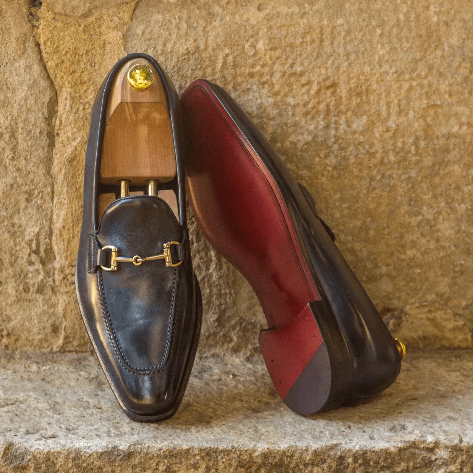 Dre Patina Loafers featuring elegant leather design and distinctive red soles
