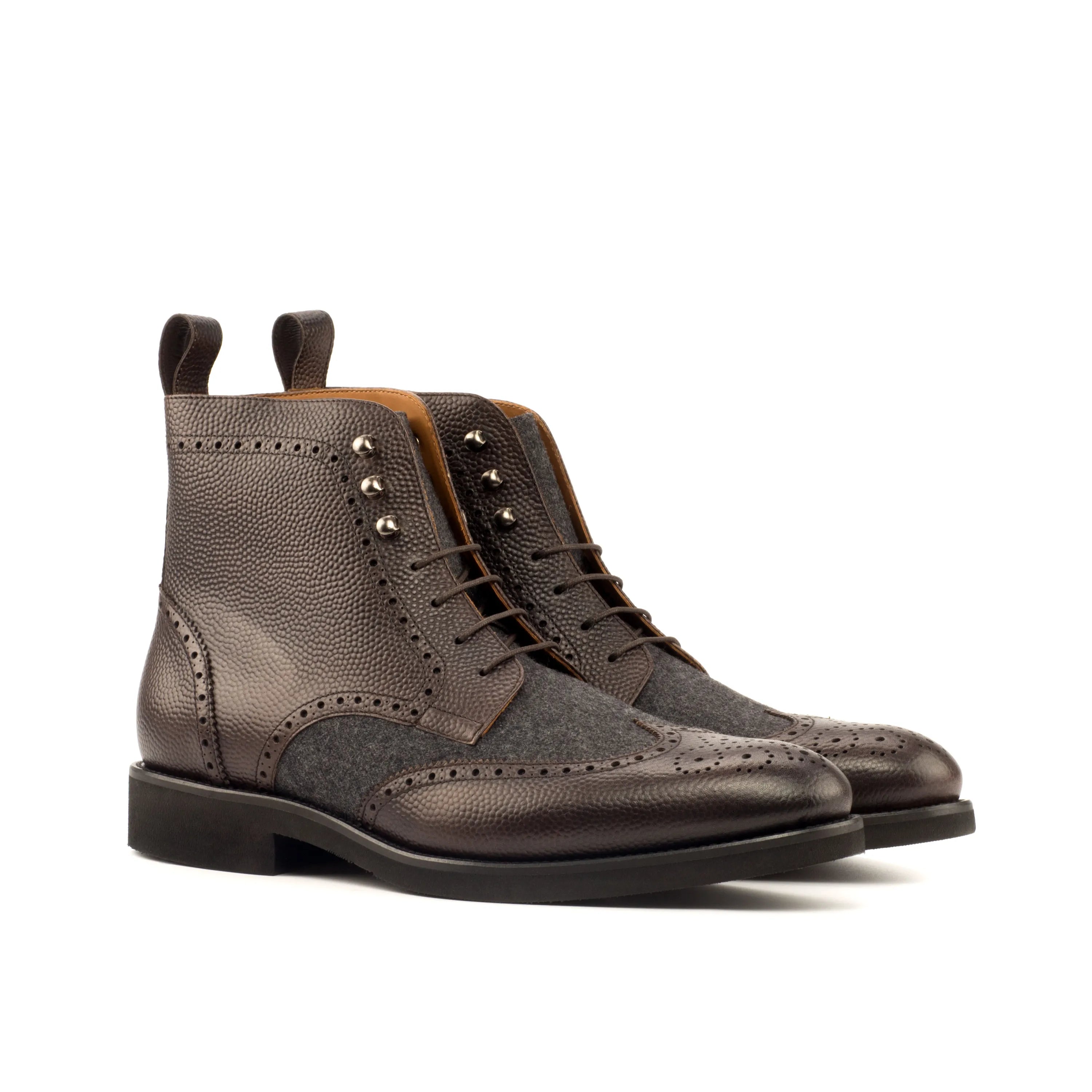 Brown leather wingtip boots, styled as Dubai Military Brogue Boots for rugged sophistication
