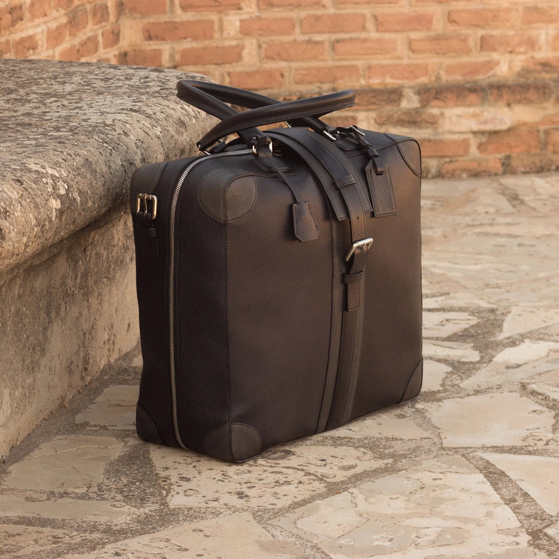 Dark leather travel bag, part of the Dubai travel tote collection showcasing unique savoir-faire