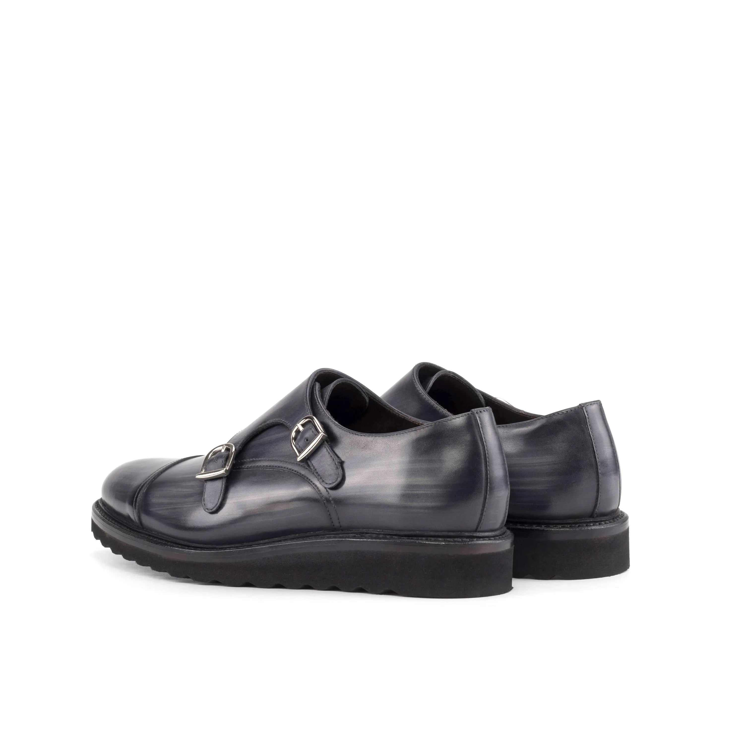 Pair of gray leather monk strap shoes from the Dukhan Patina Double Monk collection