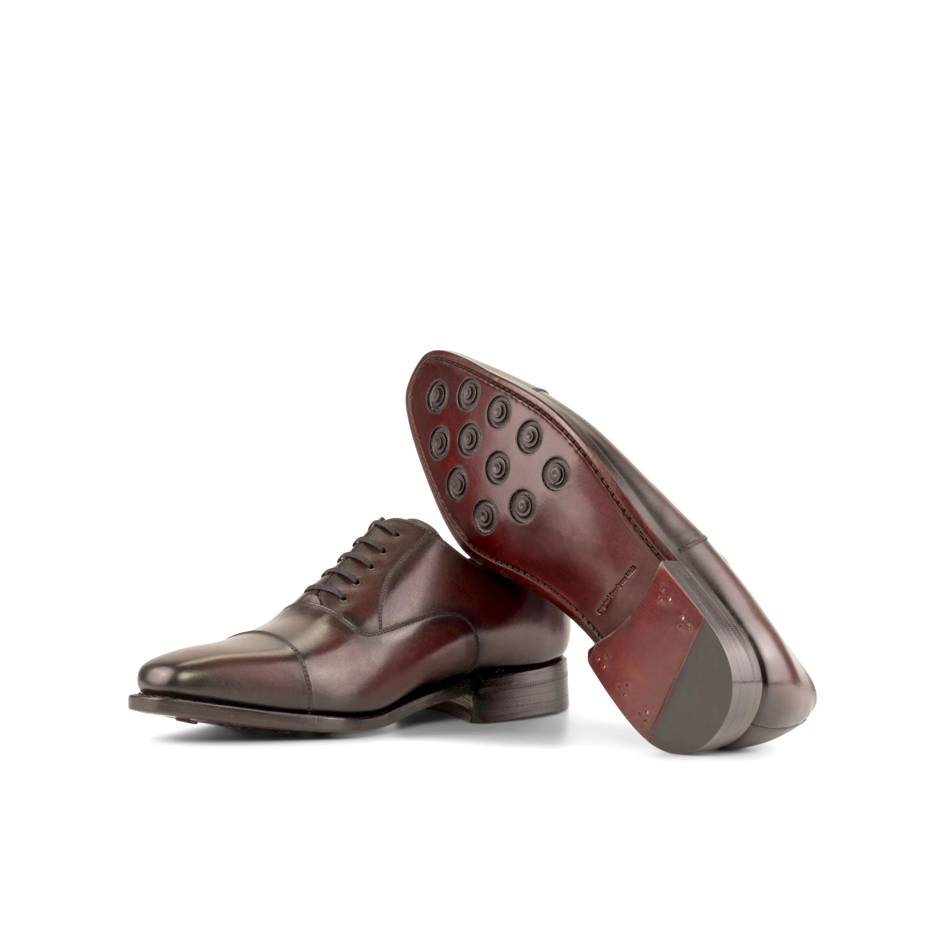 Pair of brown leather dress shoes featuring Duran Oxford Shoes design for stylish elegance
