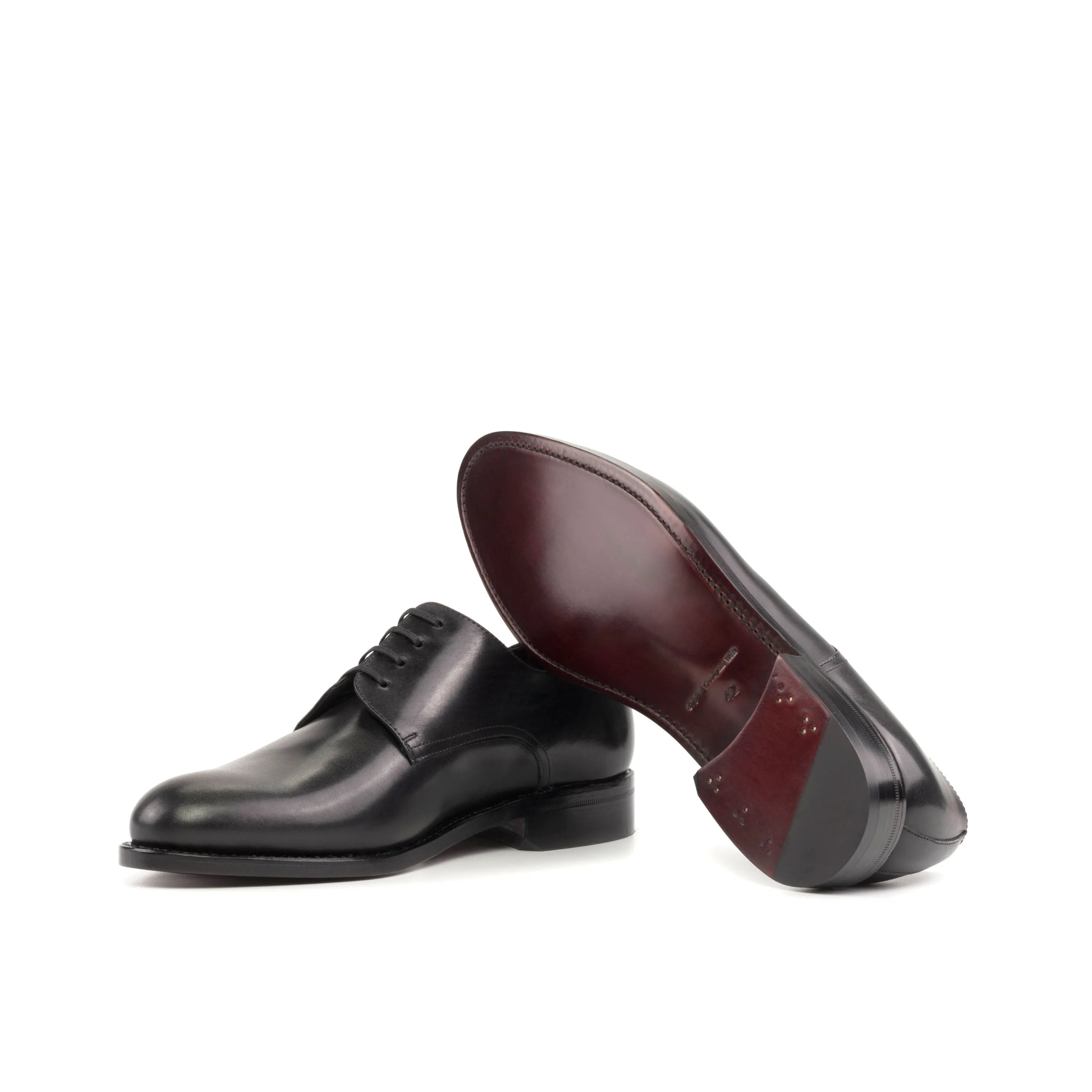 Pair of black leather Edanos Derby shoes for a stylish and formal look in fast lane fashion