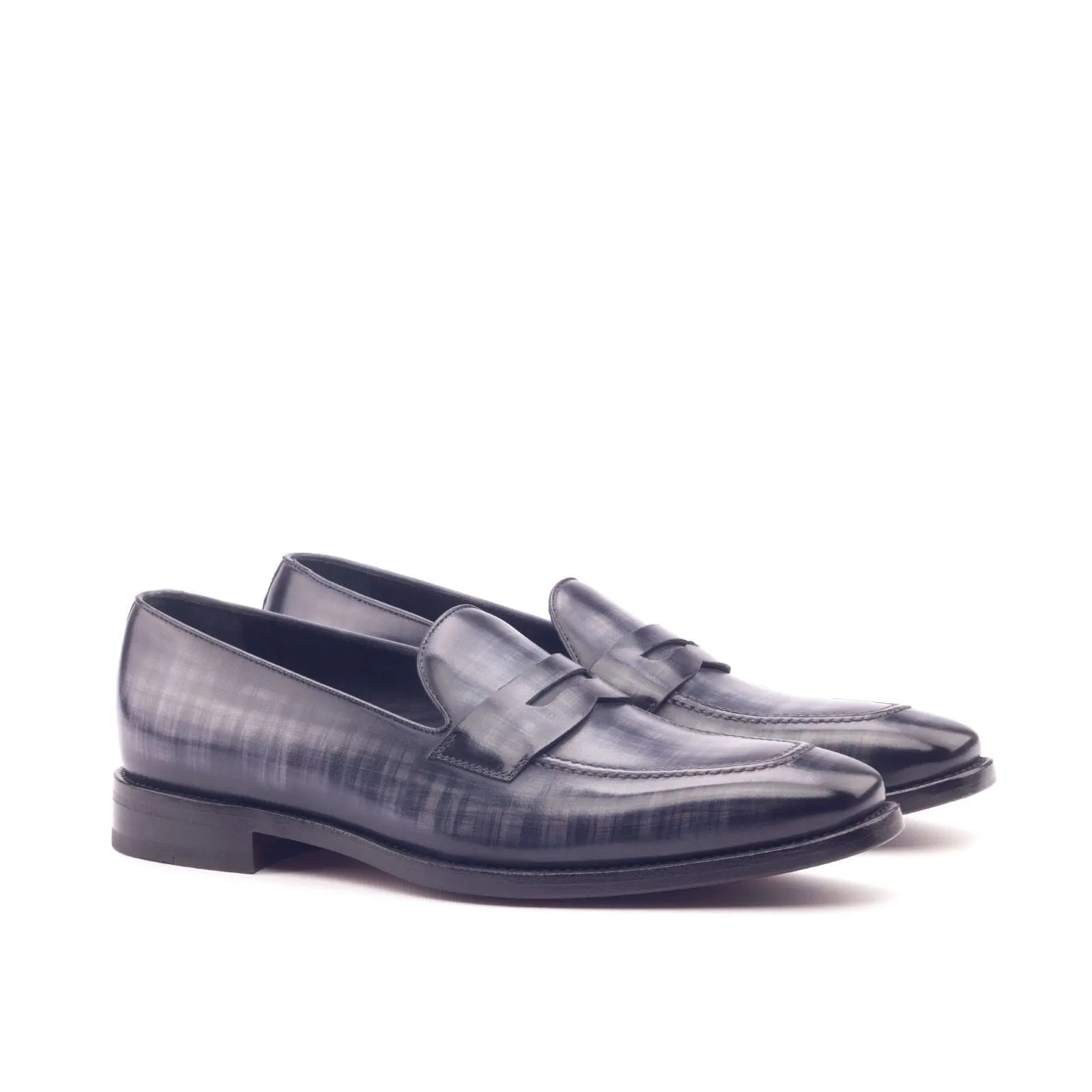 Pair of black leather Edisons Patina Loafers showcasing elegant design and craftsmanship