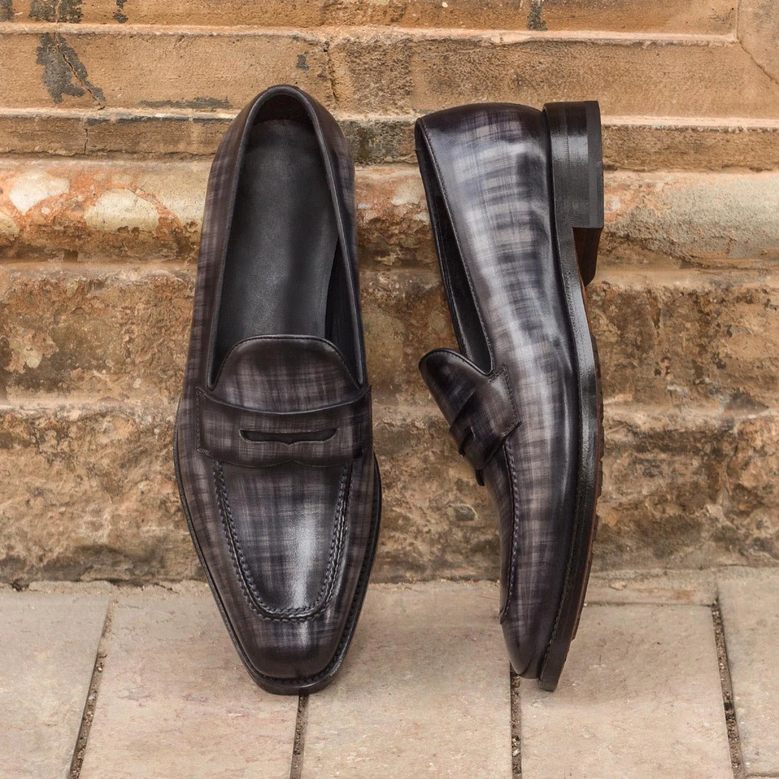 Pair of gray leather Edisons Patina Loafers showcasing elegant design and quality craftsmanship