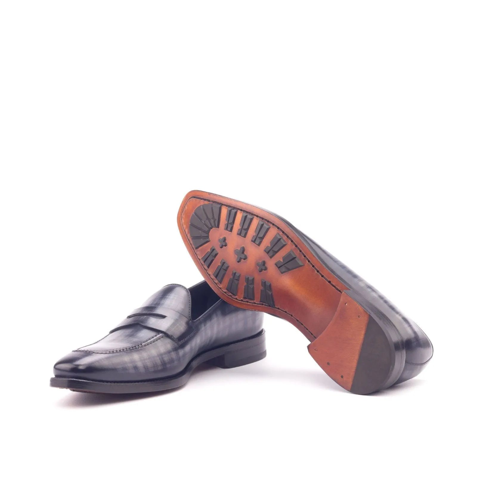 Pair of Edisons Patina Loafers showcasing elegant leather craftsmanship and classic style